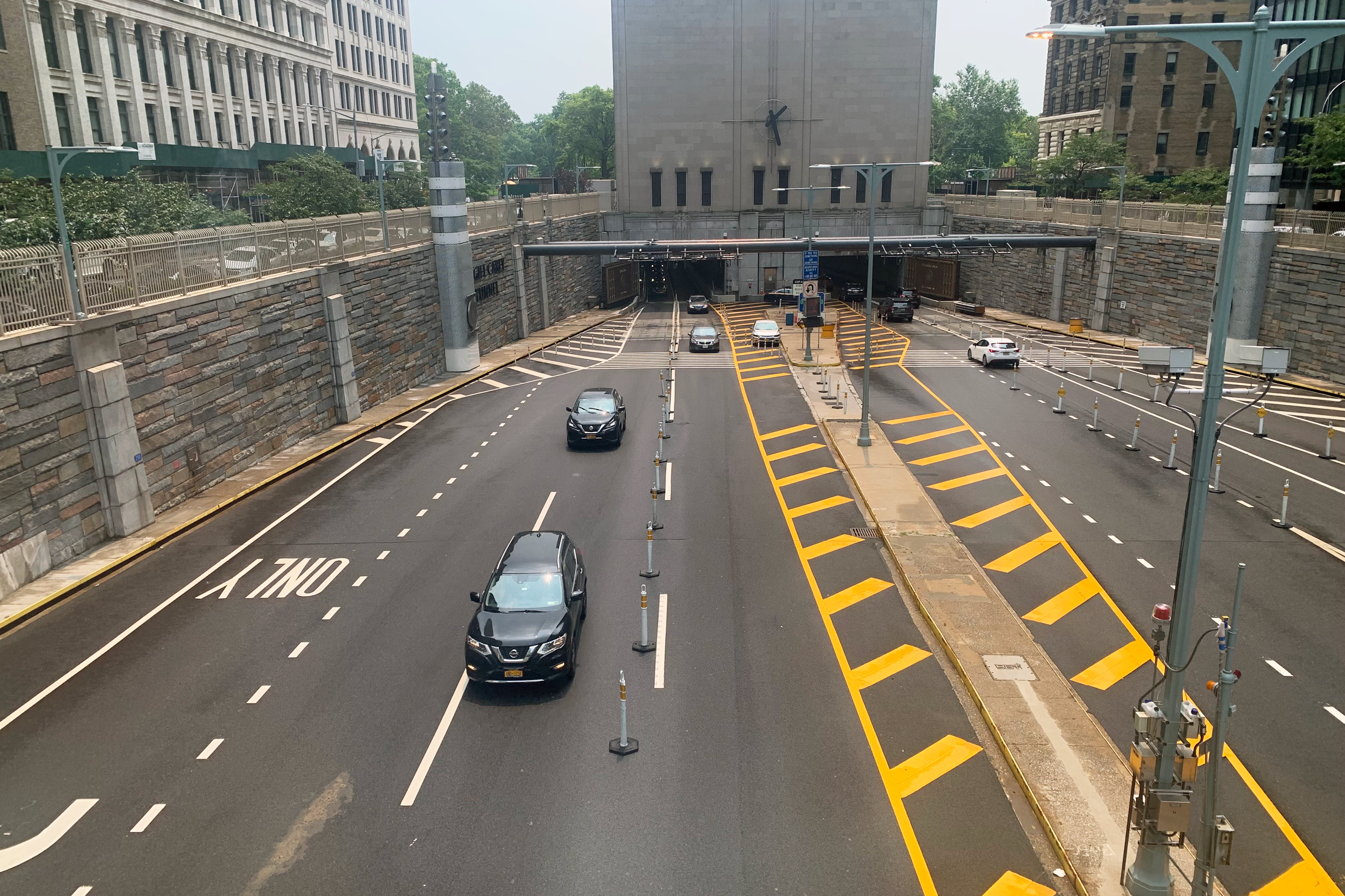 People drive out of the Hugh Carey Battery Tunnel in lower Manhattan, July 21, 2021.