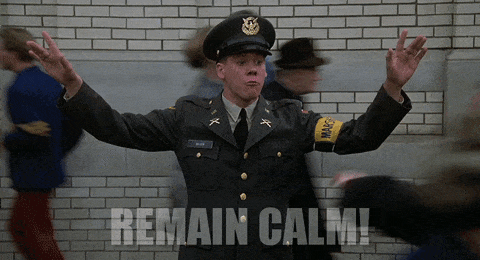 GIF of Kevin Bacon in Animal House telling people to remain calm