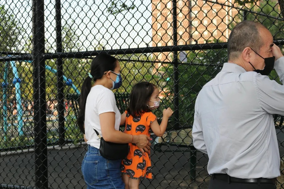 Jessica Stowe waves goodbye to her son on his first day of kindergarten at P.S. 184 Shuang Wen in Manhattan.﻿
