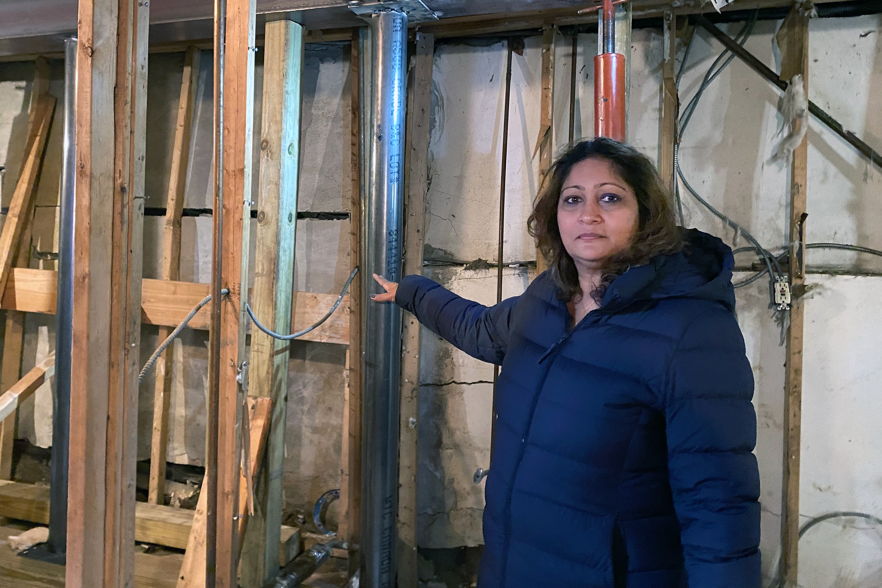 Amrita Bhagwandin shows damage to her Queens home.