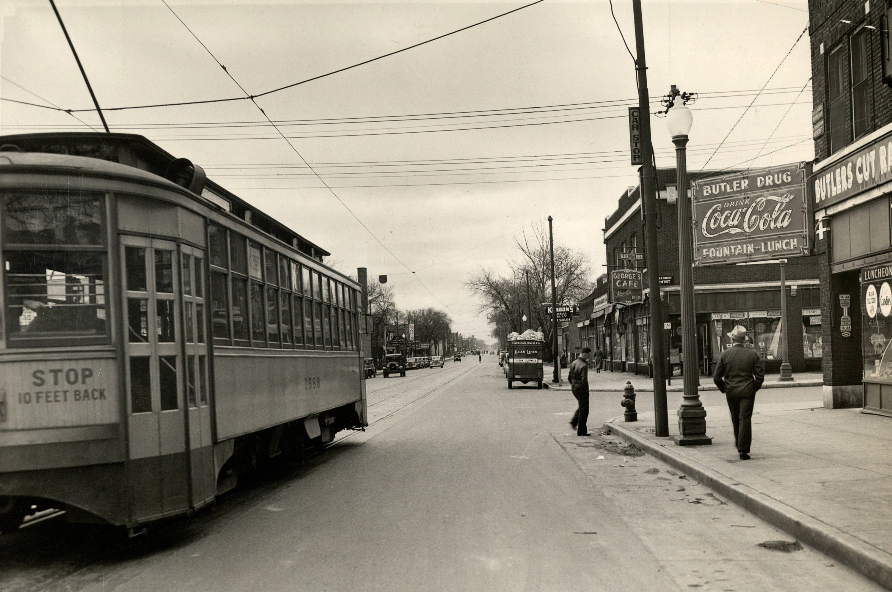 A streetcar travels south on Nicollet Avenue at 26th Street in 1938.