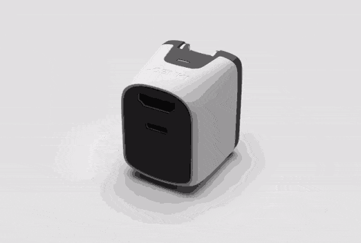 The charger rotates in this animated GIF, showing the design of a curved cube.