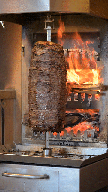 Shawarma at Saffy's spinning next to hot flames.