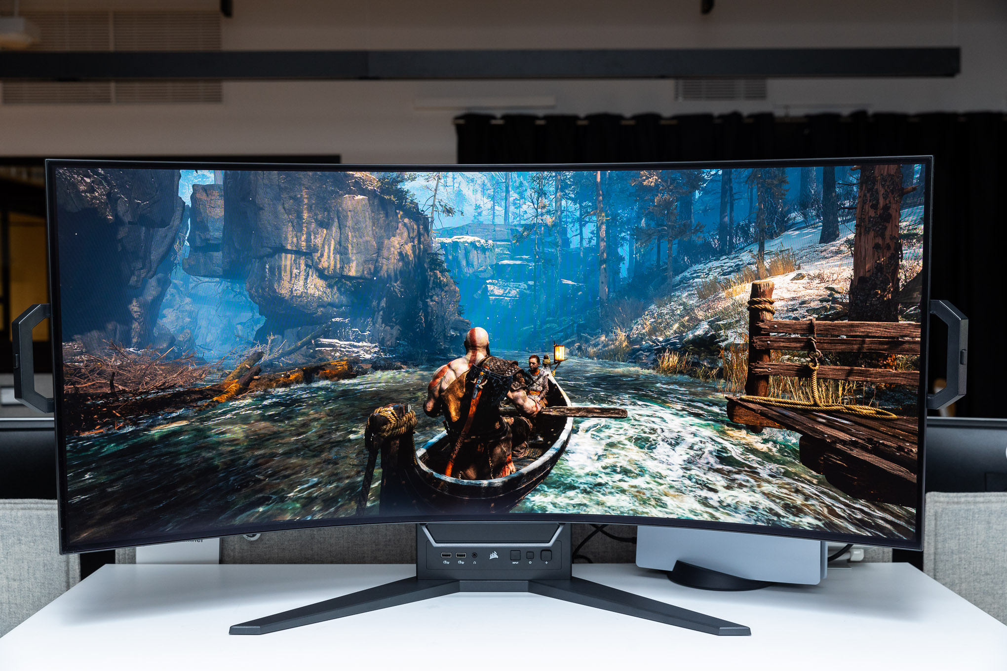 The Xeneon Flex in its curved orientation showing off God of War on PC