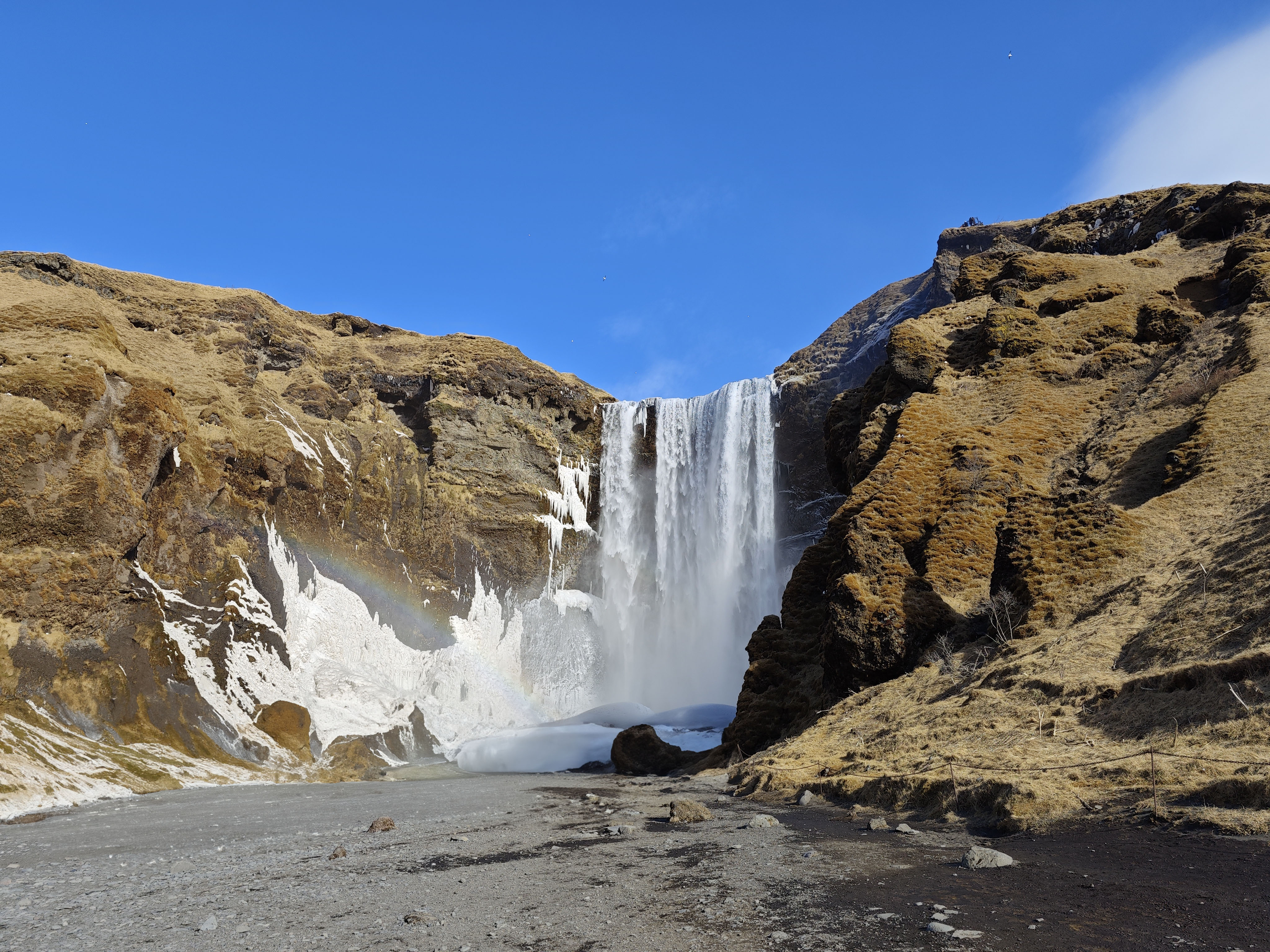 Photo of Skogafoss with people removed with generative fill.