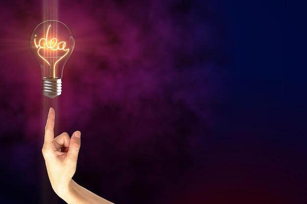 hand-with-creative-glowing-idea-lamp-purple-smoke-background-with-copy-space-innovation-success-concept_670147-51709.0.jpg