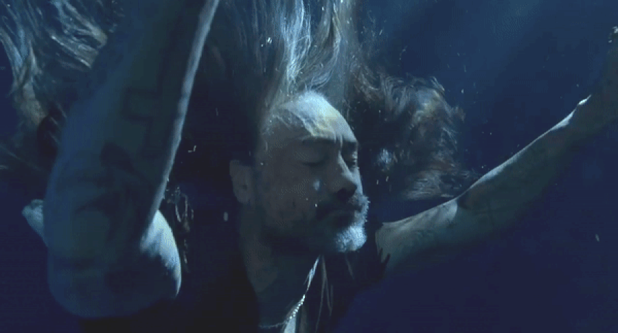 Taika Waititi as Blackbeard is pulled underwater in a sequence from Our Flag Means Death season 2