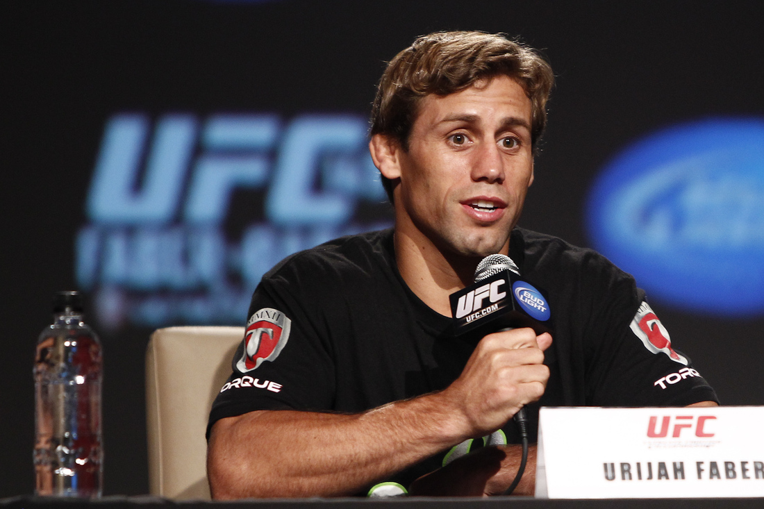 Urijah Faber answers a question during the UFC 149 pre-fight press conferen...