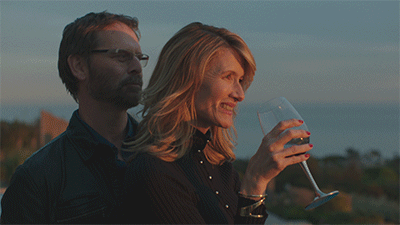 GIF of Laura Dern drinking wine