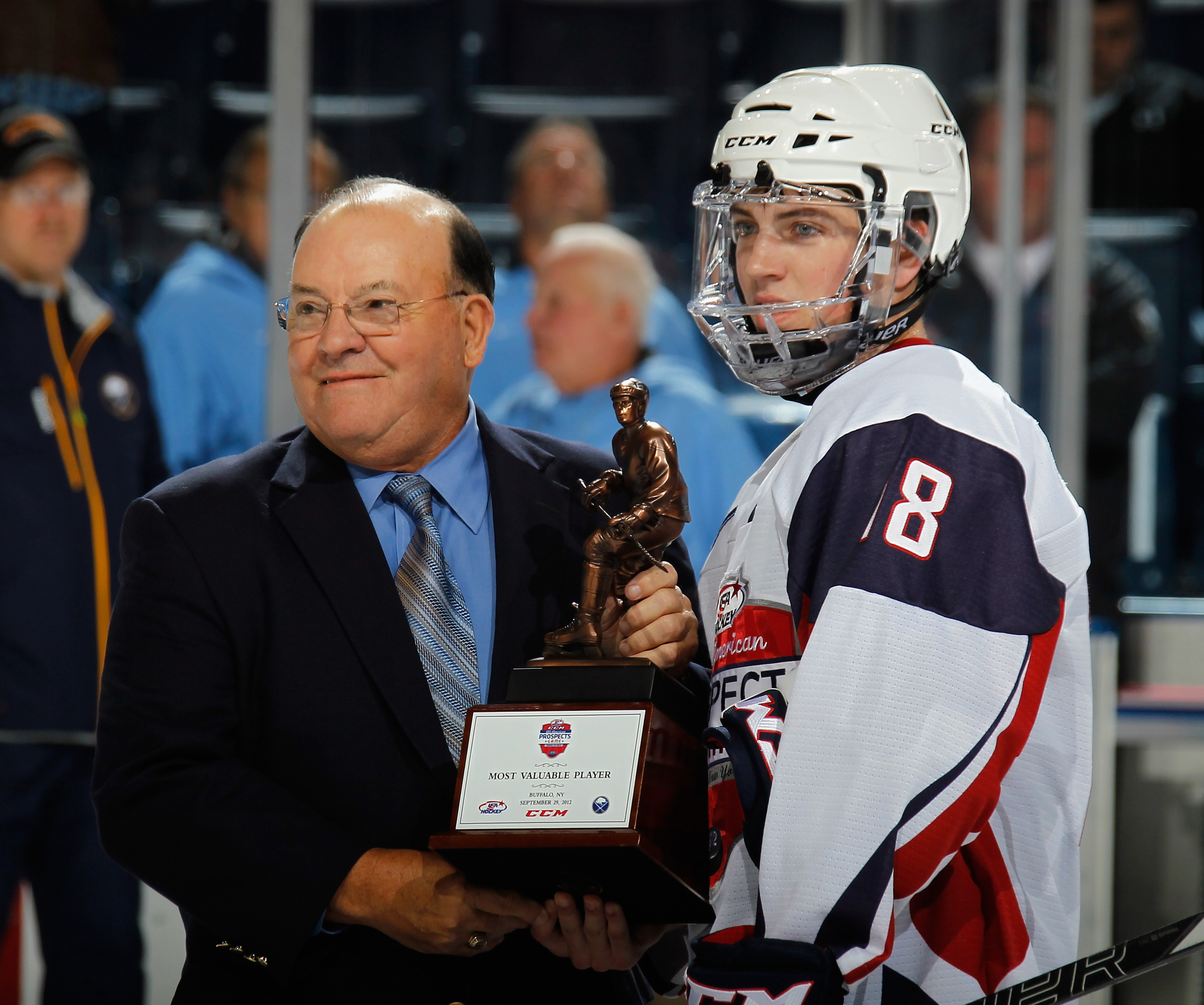 Ryan Fitzgerald collects his MVP trophy from Scotty Bowman following the All-American Prospects Game.