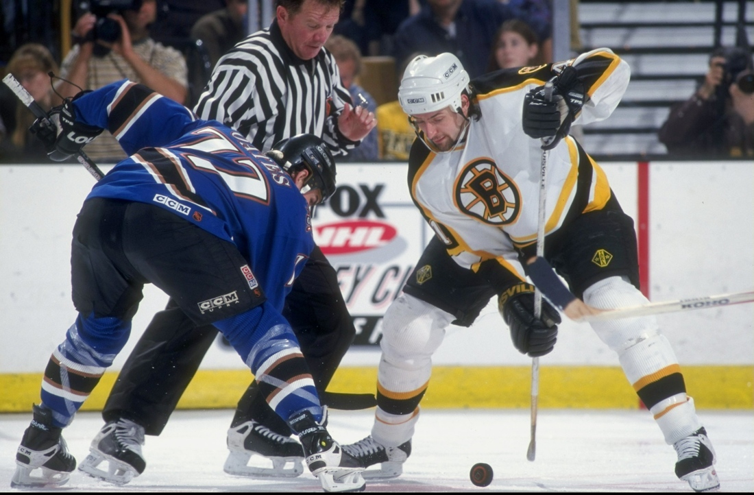 3 May 1998: Center Jason Allison of the Boston Bruins (right) in action against center Adam Oates of the Washington Capitals during their game at the Fleet Center in Boston, Massachuttes. The Capitals defeated the Bruins 3-2.