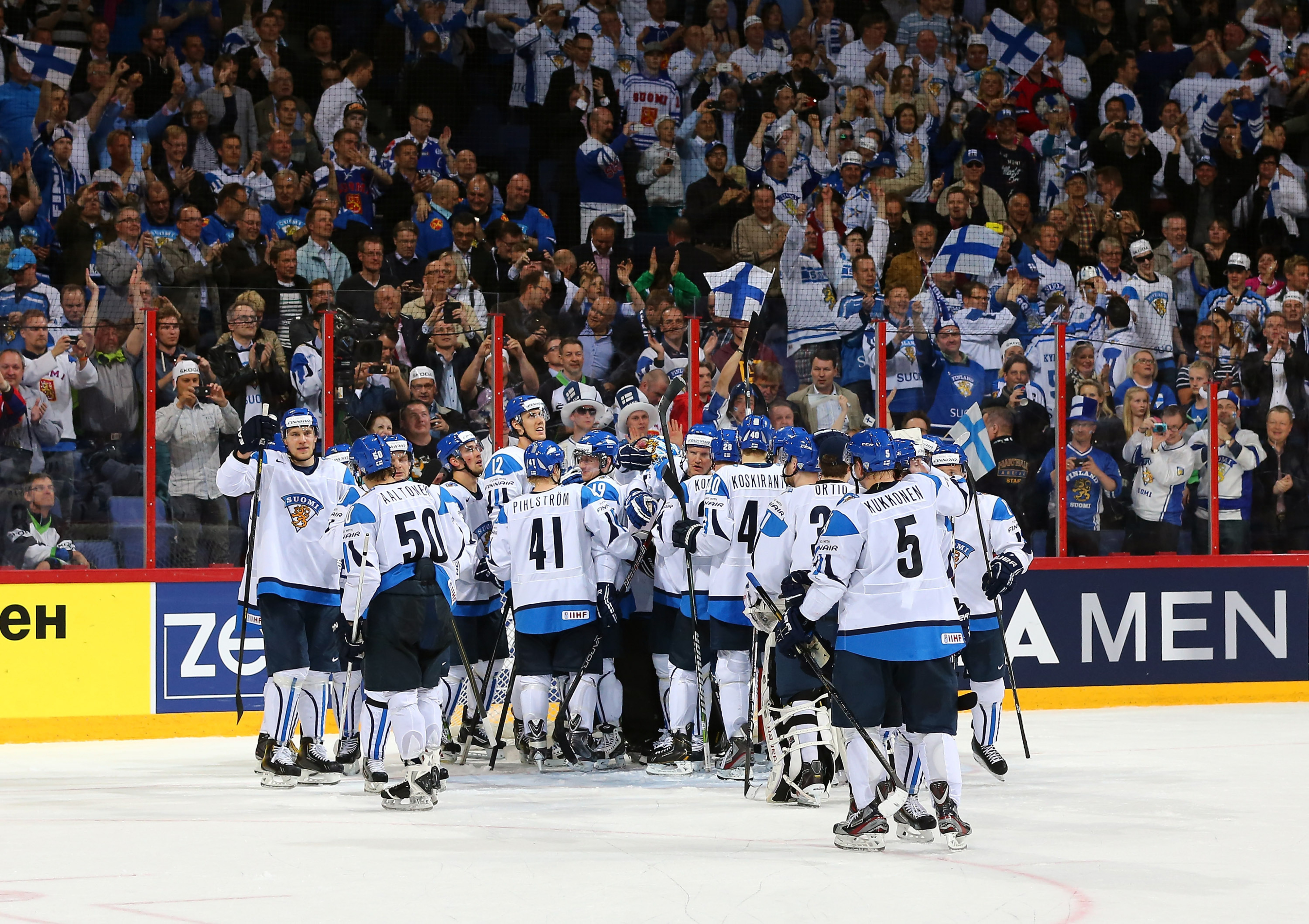 Finland celebrates a win over Slovakia in the 2013 IIHF World Championships Quarterfinal.