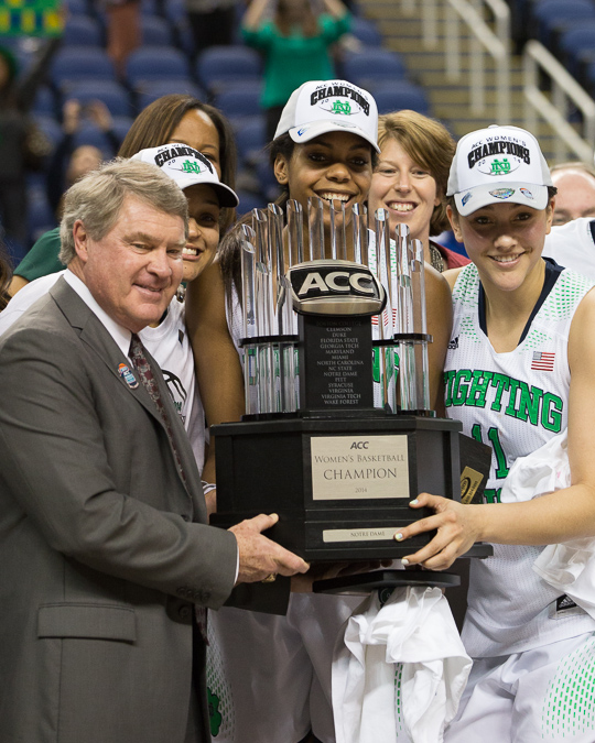 Notre Dame is presented the championship trophy by ACC Commissioner John Swofford