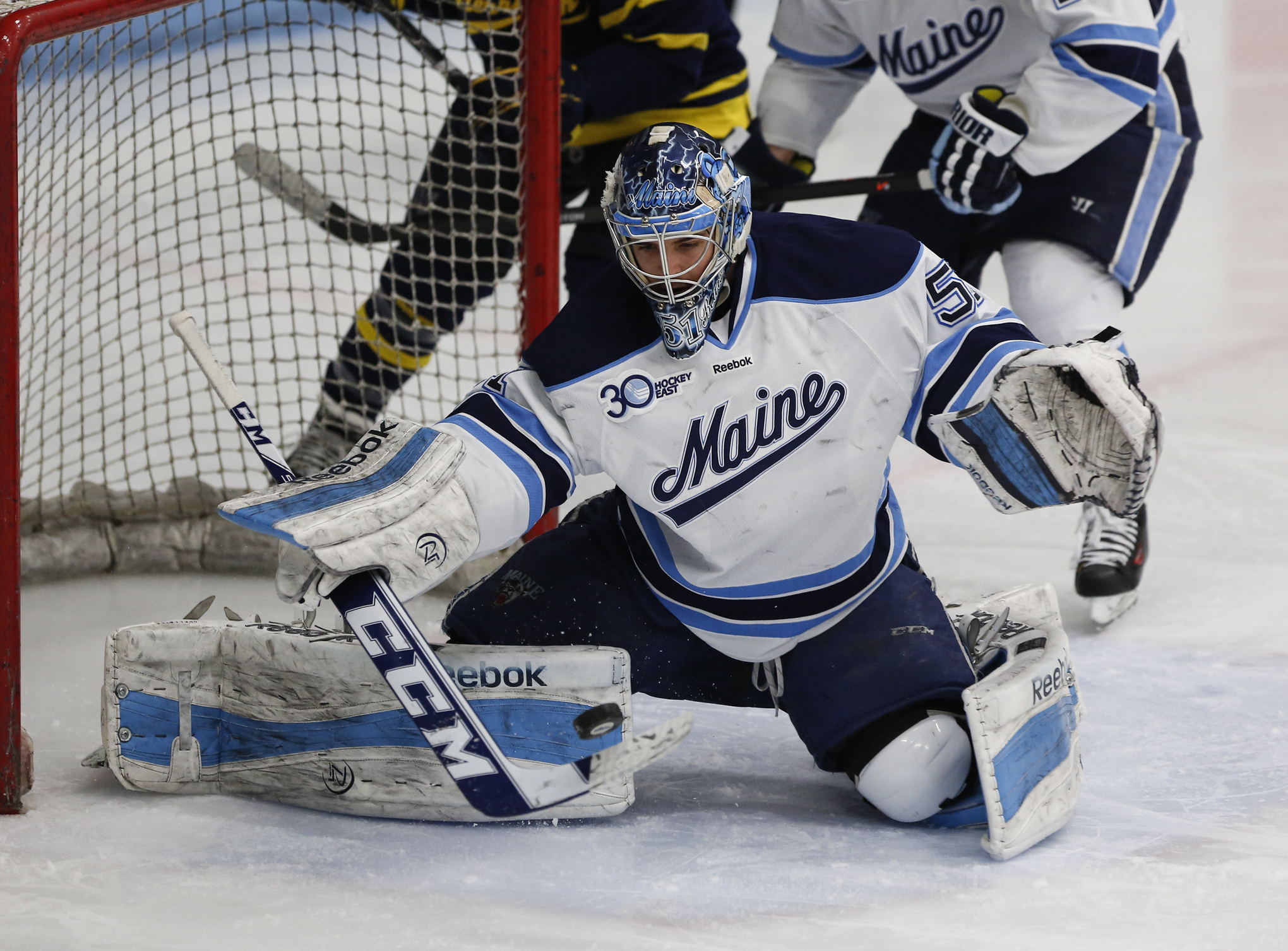 Maine senior goaltender Martin Ouellette makes one of his 29 saves in his team's 2-0 Hockey East playoff victory over Merrimack.