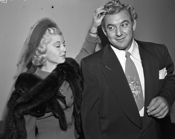 Gorgeous George Wagner with his wife Elizabeth (Betty) at court for name change in Los Angeles, Calif., 1950 