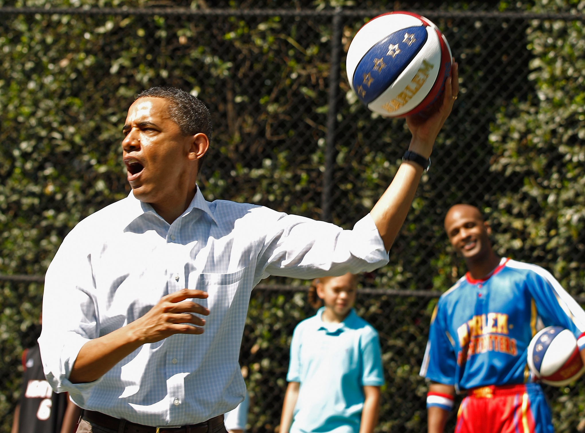 Barack Obama plays a basketball game