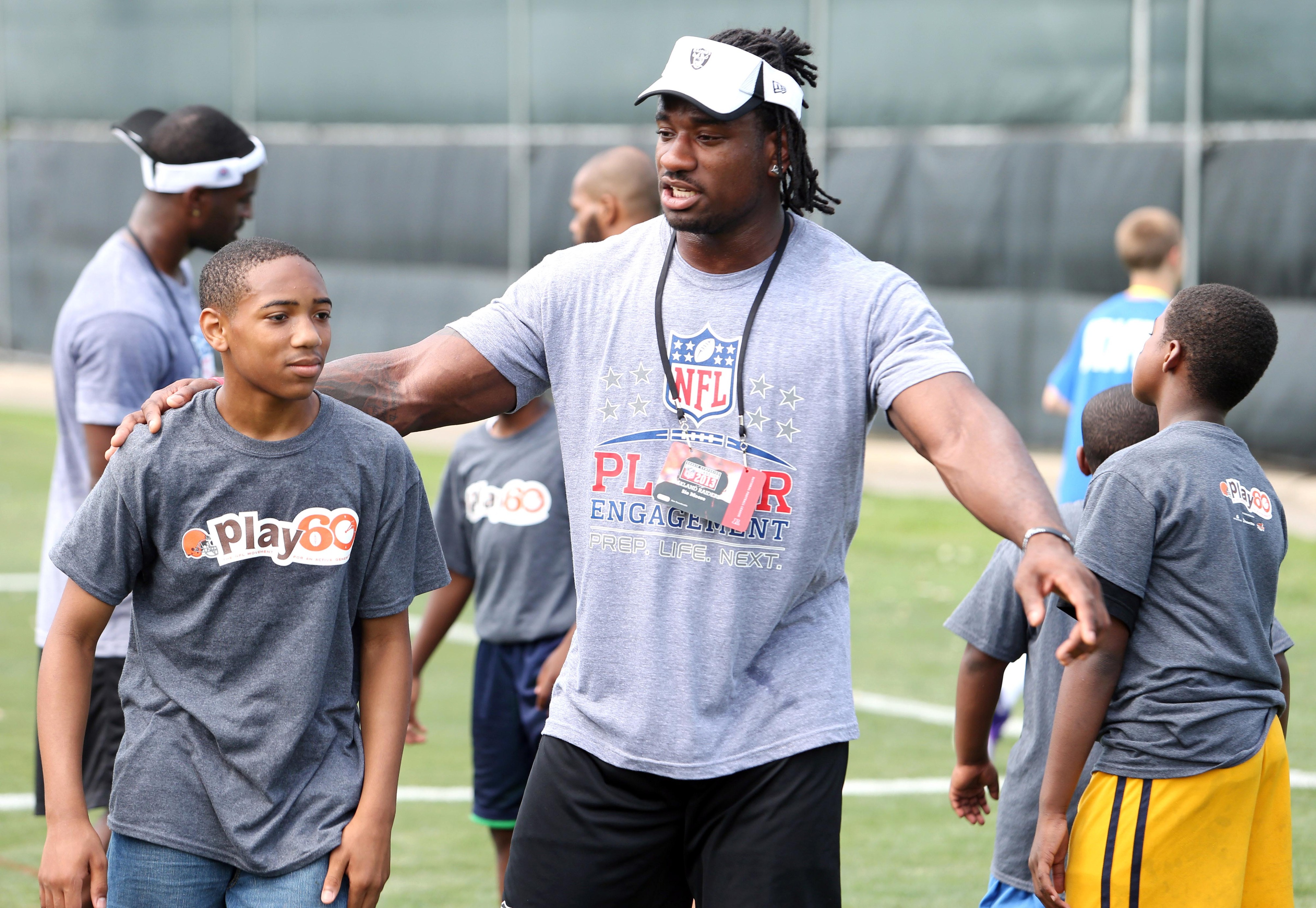 Oakland Raiders linebacker Sio Moore engaging in NFL Play 60 at the 2013 Rookie Symposium