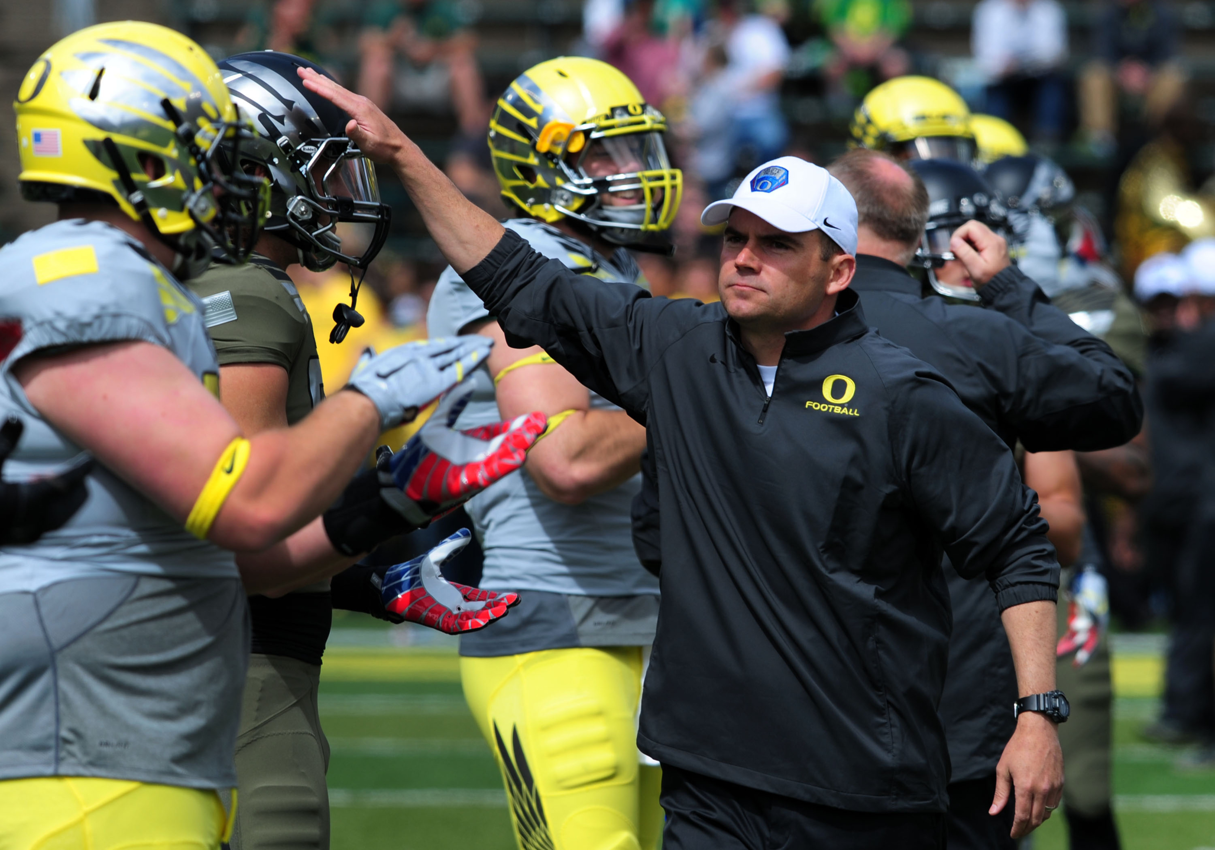 Oregon head coach Mark Helfrich and his team were picked by many to win the Pac-12 North.