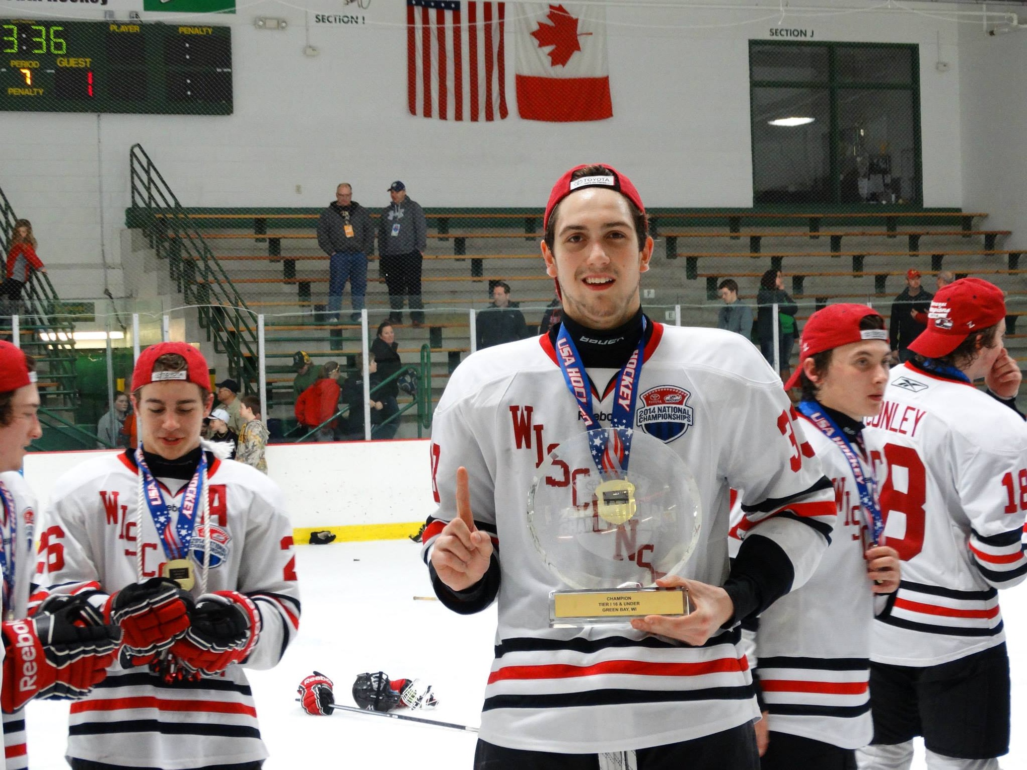 Adam Parsells poses after winning the USA Hockey Tier 1 national championship with Team Wisconsin.