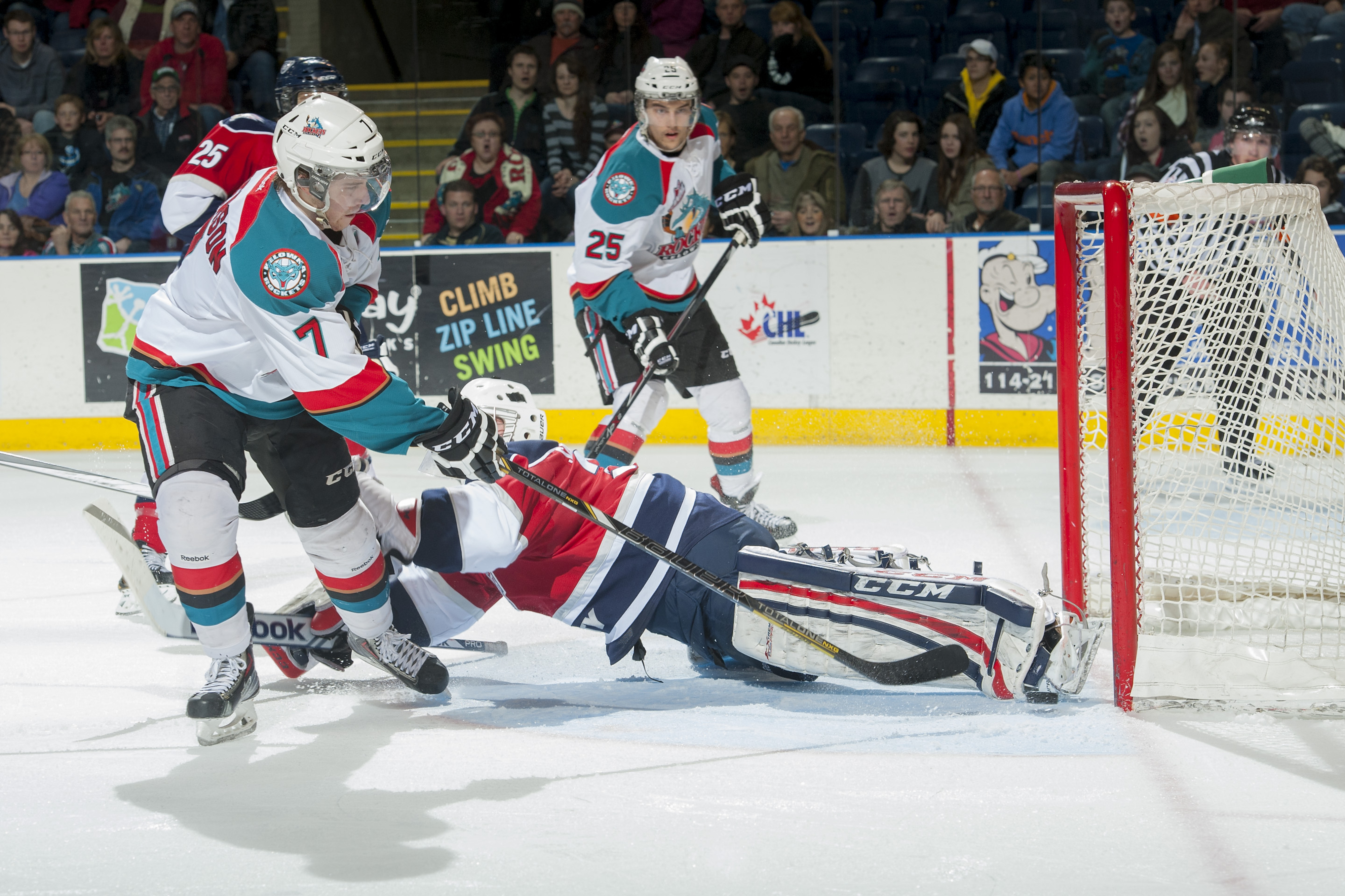 Damon Severson #7 of the Kelowna Rockets scores the seventh goal on Evan Sarthou #31 of the Tri City Americans during the third period on March 8, 2014 at Prospera Place in Kelowna, British Columbia, Canada.