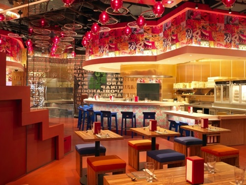The interior of a restaurant in red and yellow