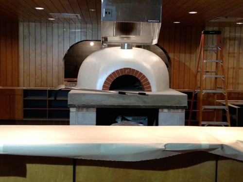 The centerpiece -- a new wood-burning oven that will cook pizzas in two minutes