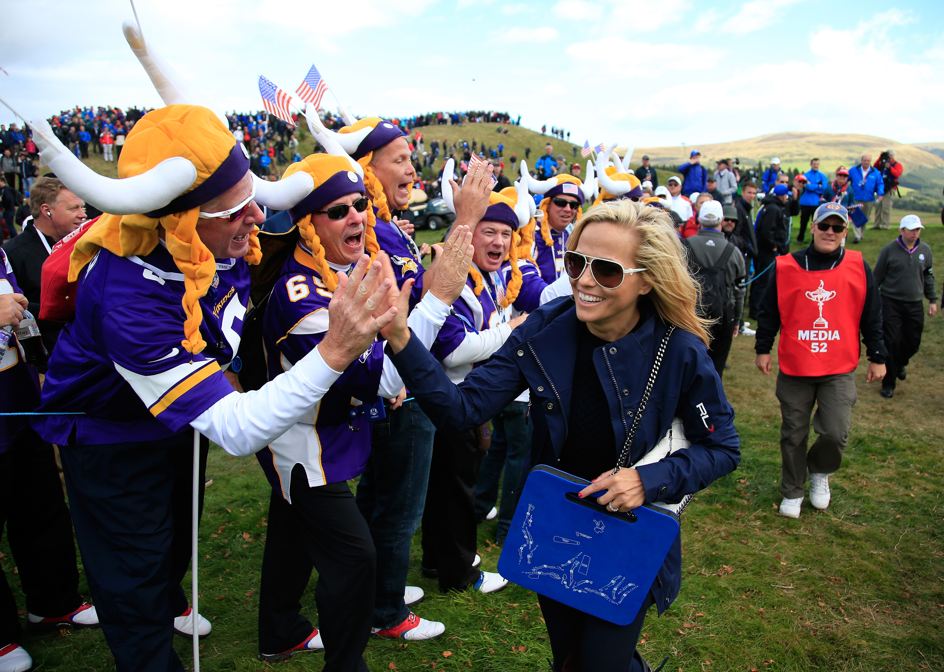 And seriously, when else am I going to use this picture of Phil Mickelson's wife high-fiving Vikings fans at the Ryder Cup?