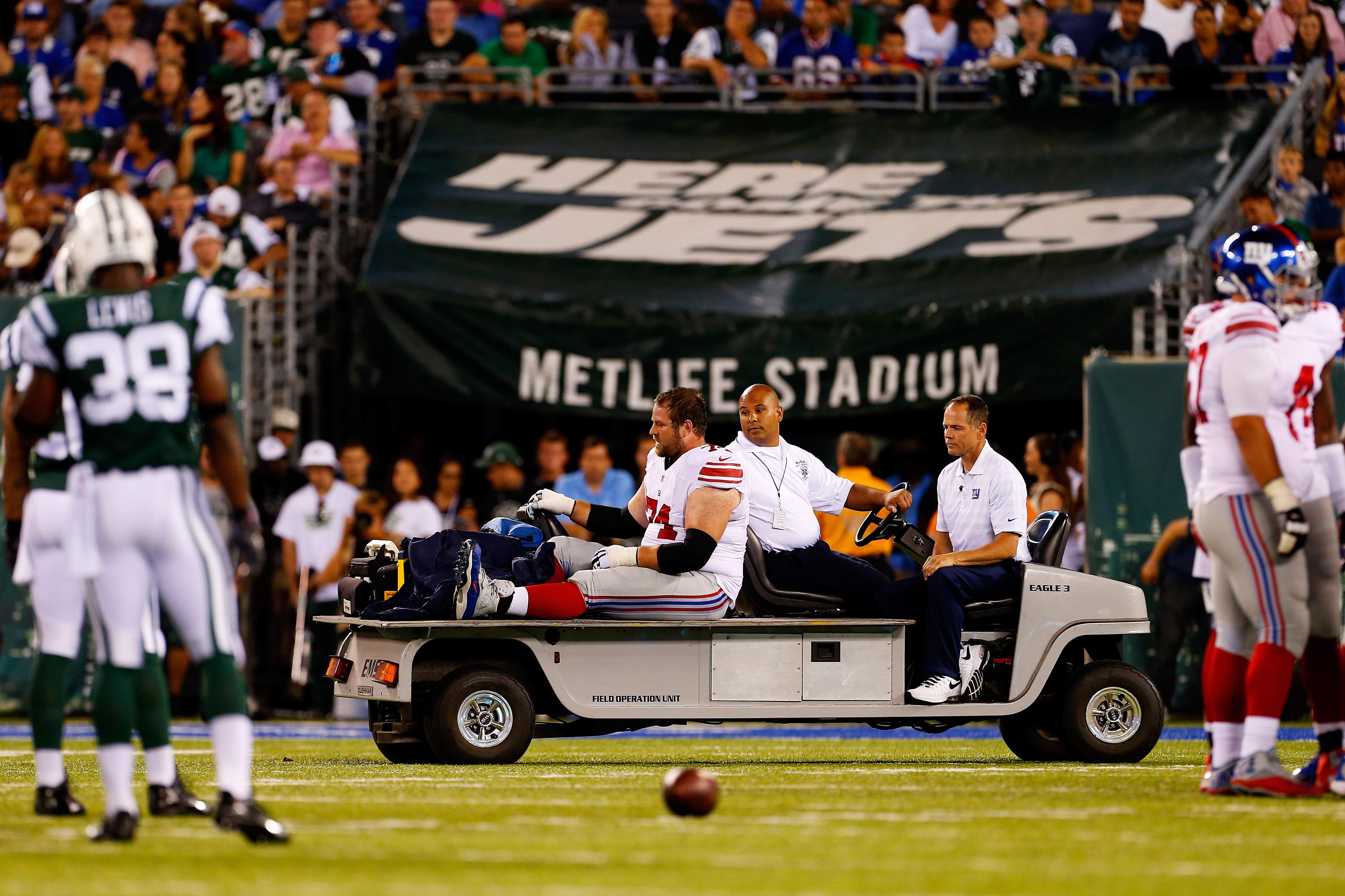 Geoff Schwartz being carted off during a preseason game against the Jets