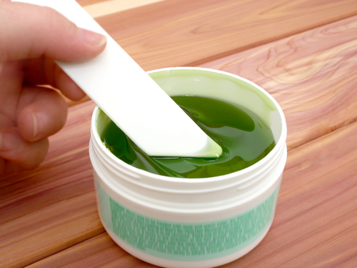 Image Via <a href="http://www.shutterstock.com/pic-51751/stock-photo-jar-of-sticky-green-hair-remover-shallow-dof-with-focus-on-applicator-and-gel.html">Shutterstock</a>