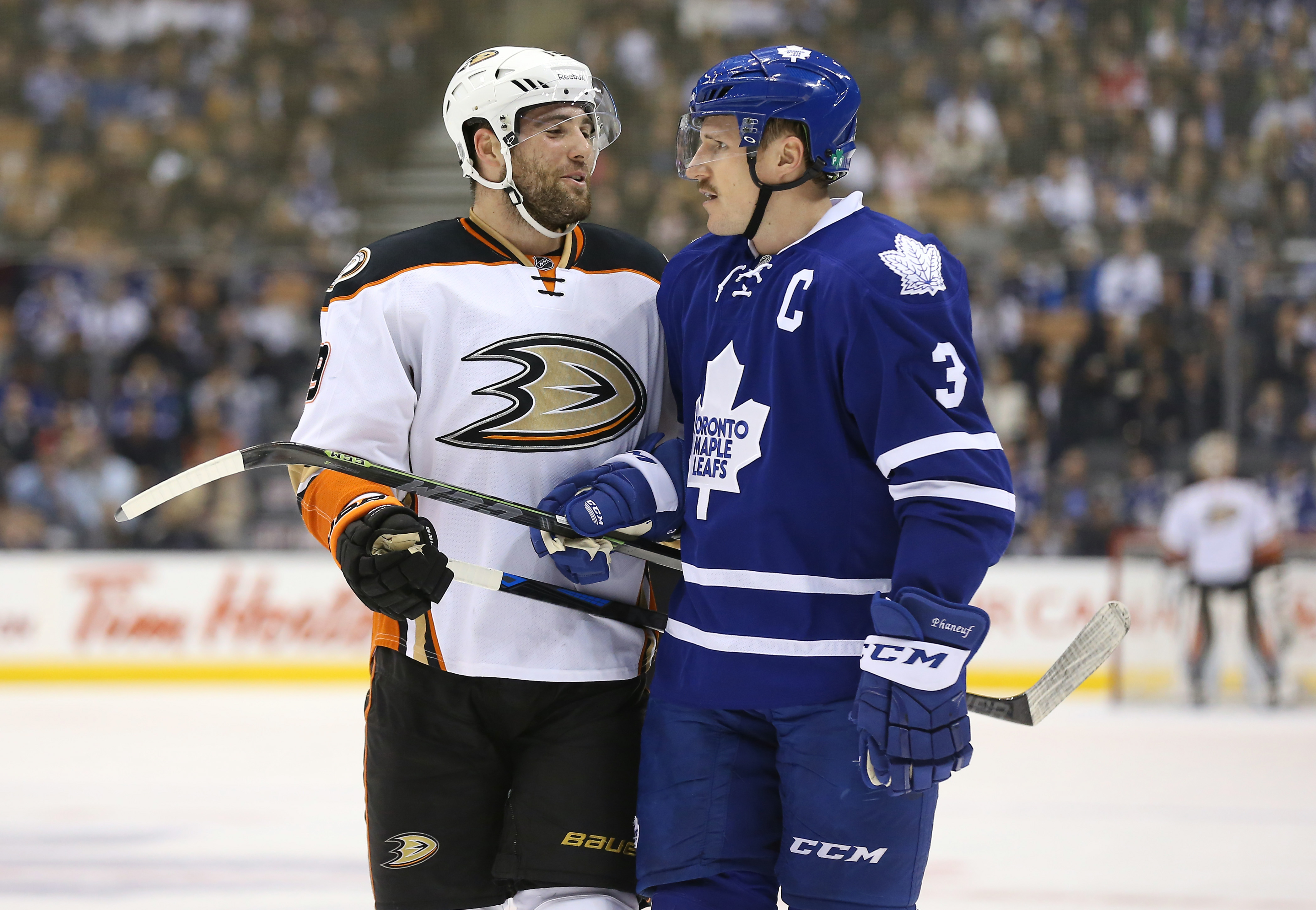 Patrick Maroon shares a word with Dion Phaneuf earlier this season.