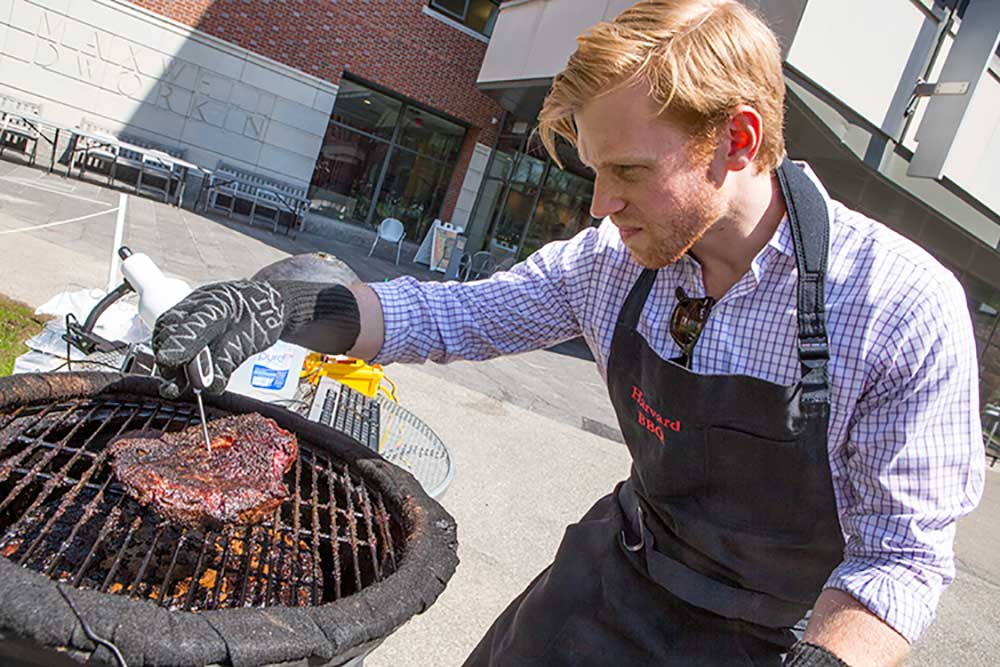 A "Harvard BBQ" student with the smoker. 