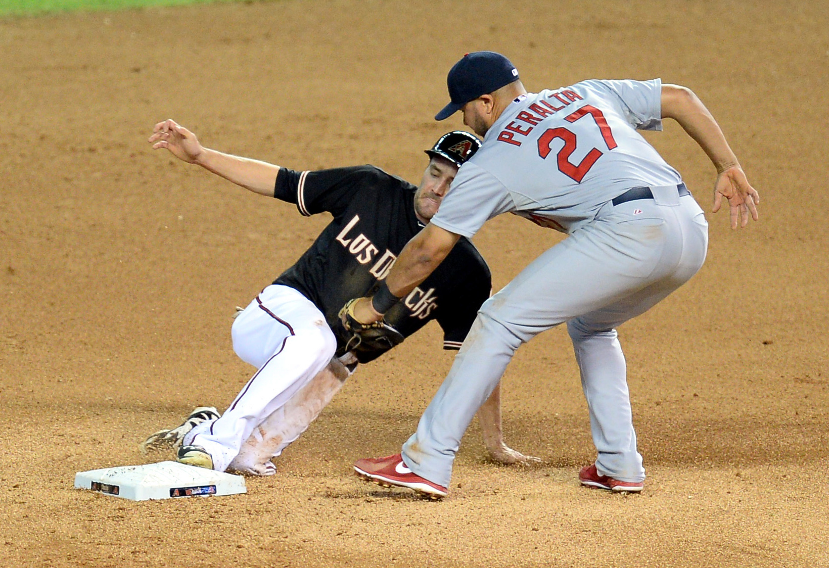 Jhonny Peralta tags out AJ Pollock in last season's September matchup.