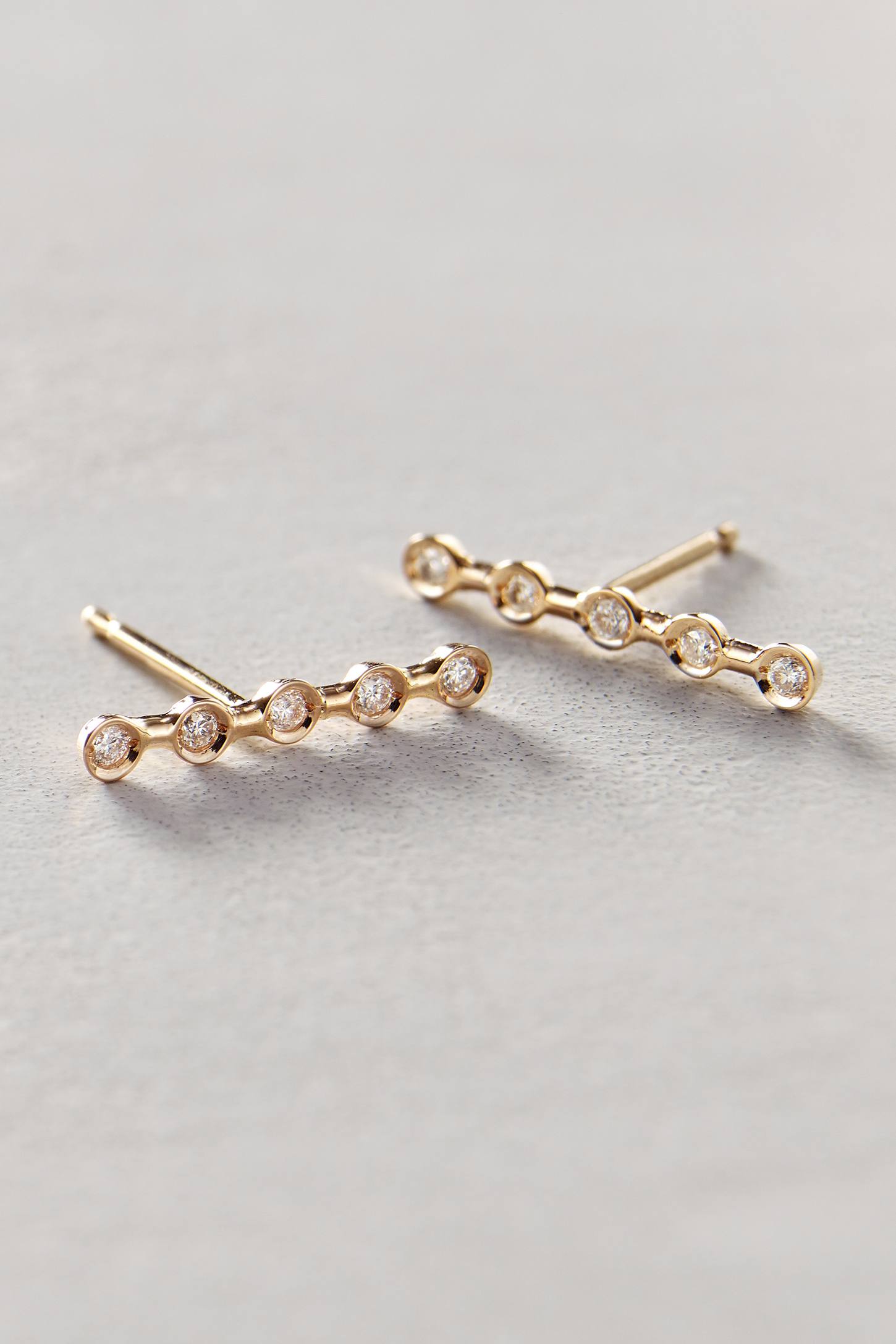 Ariel Gordon horizon earrings in 14K gold, <a href="http://www.anthropologie.com/anthro/product/35999184.jsp?cm_vc=SEARCH_RESULTS#/">$558.60</a>.