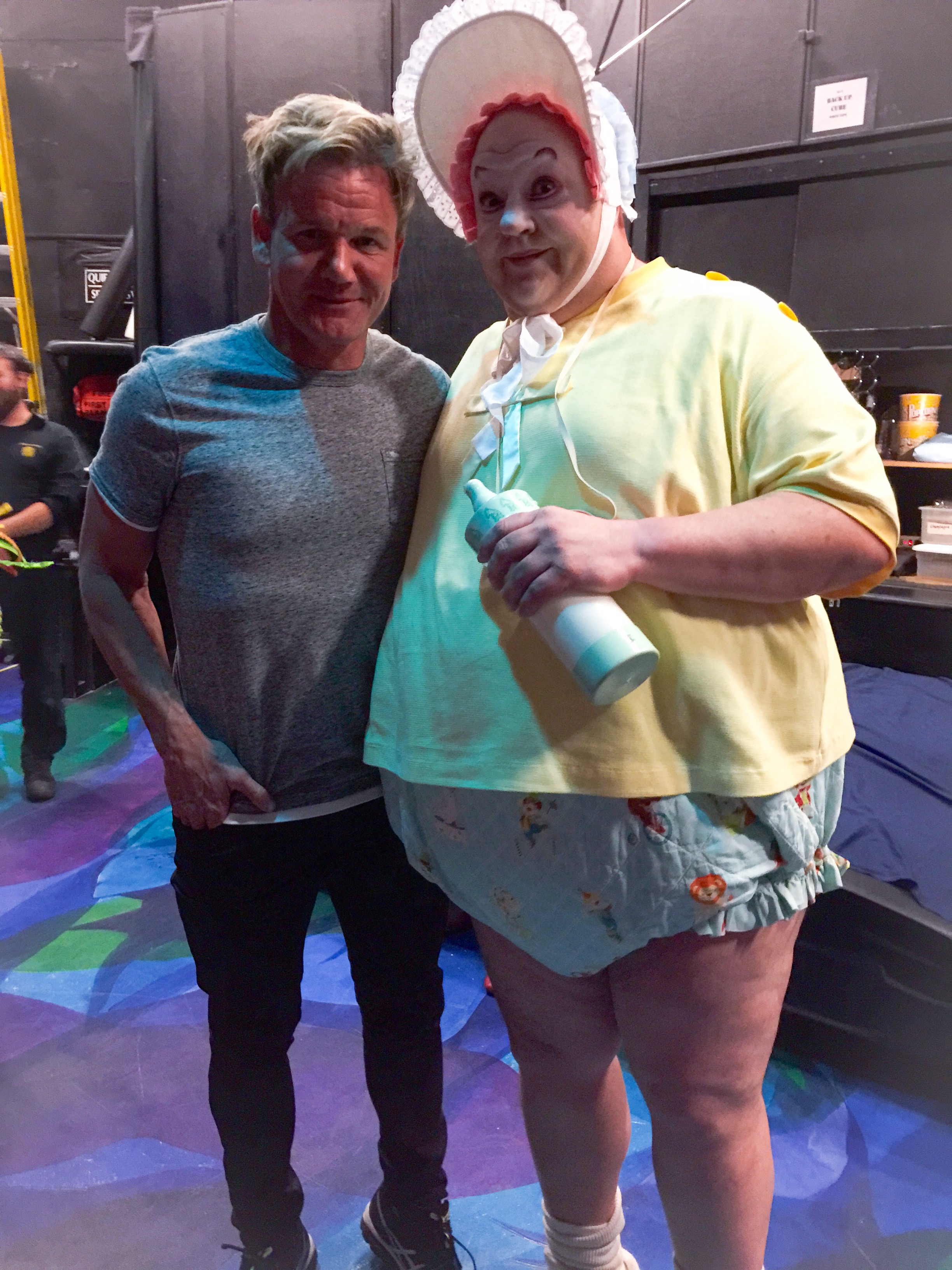 Gordon Ramsay poses with the famous gigantic baby from Mystere by Cirque du Soleil.