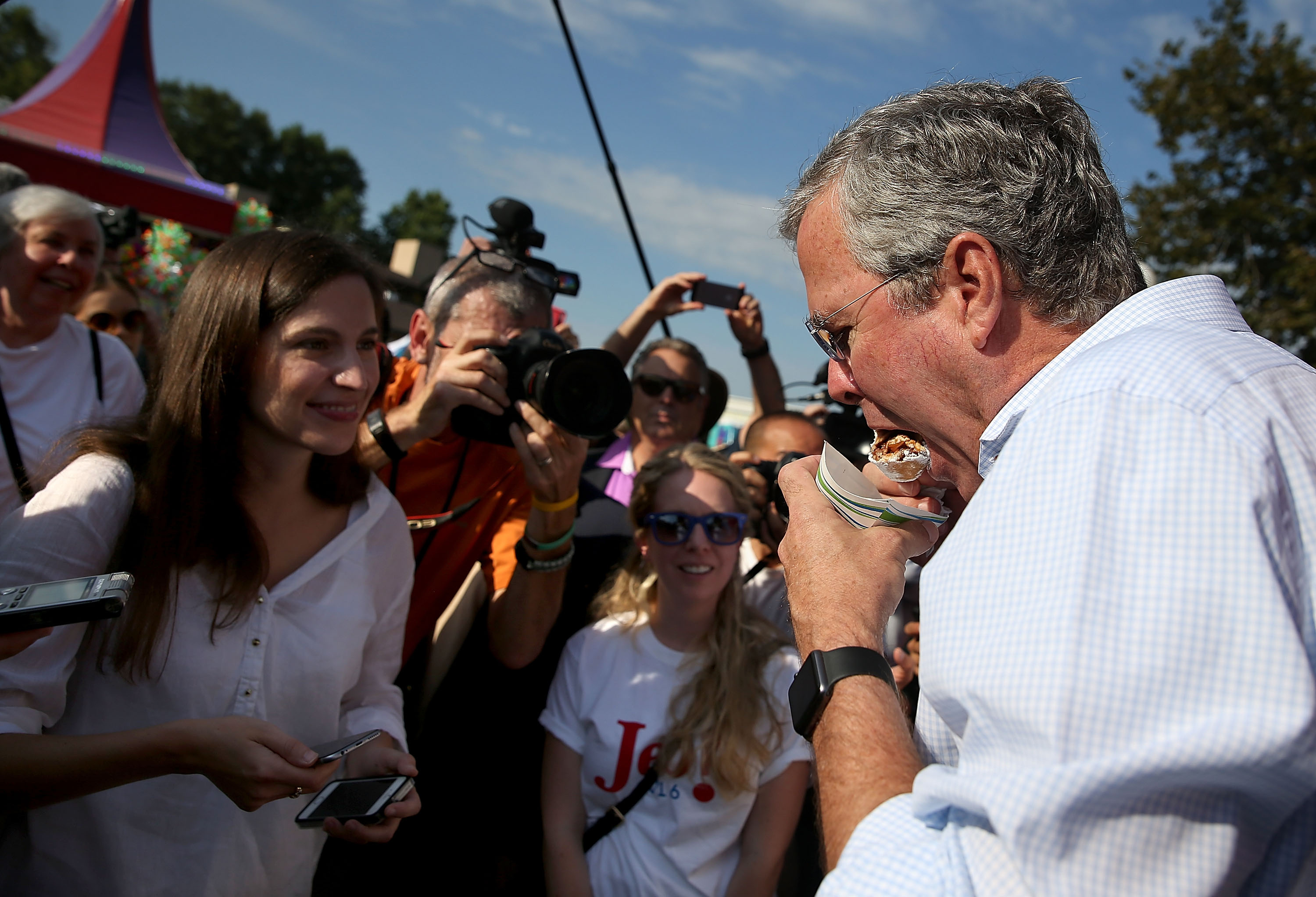 Jeb Bush devouring a fried snickers bar at the Iowa State Fair.