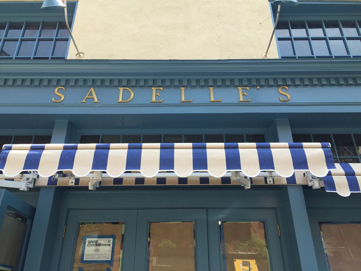[The signage for the falls most anticipated opening, Sadelle's.]