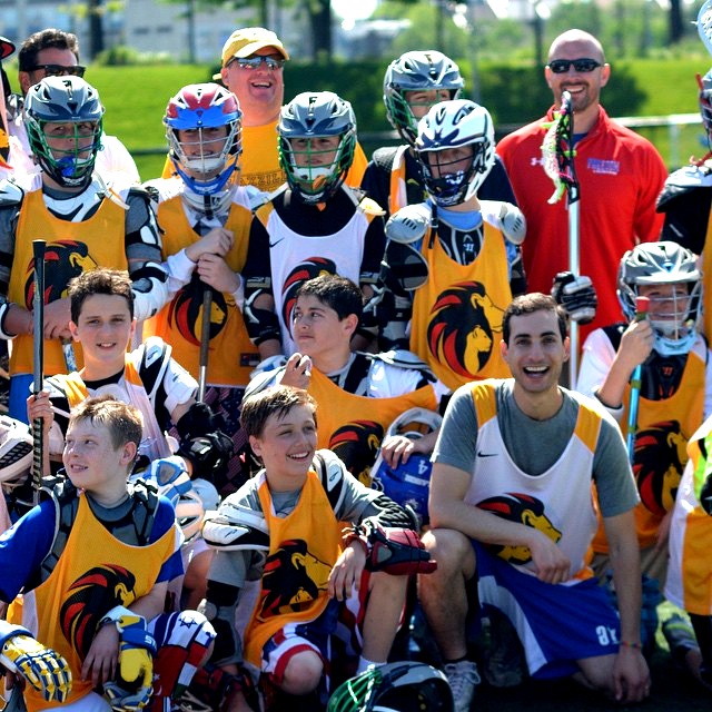Andrew Goldstein (right) organized to help young gay lax player Braeden (center).