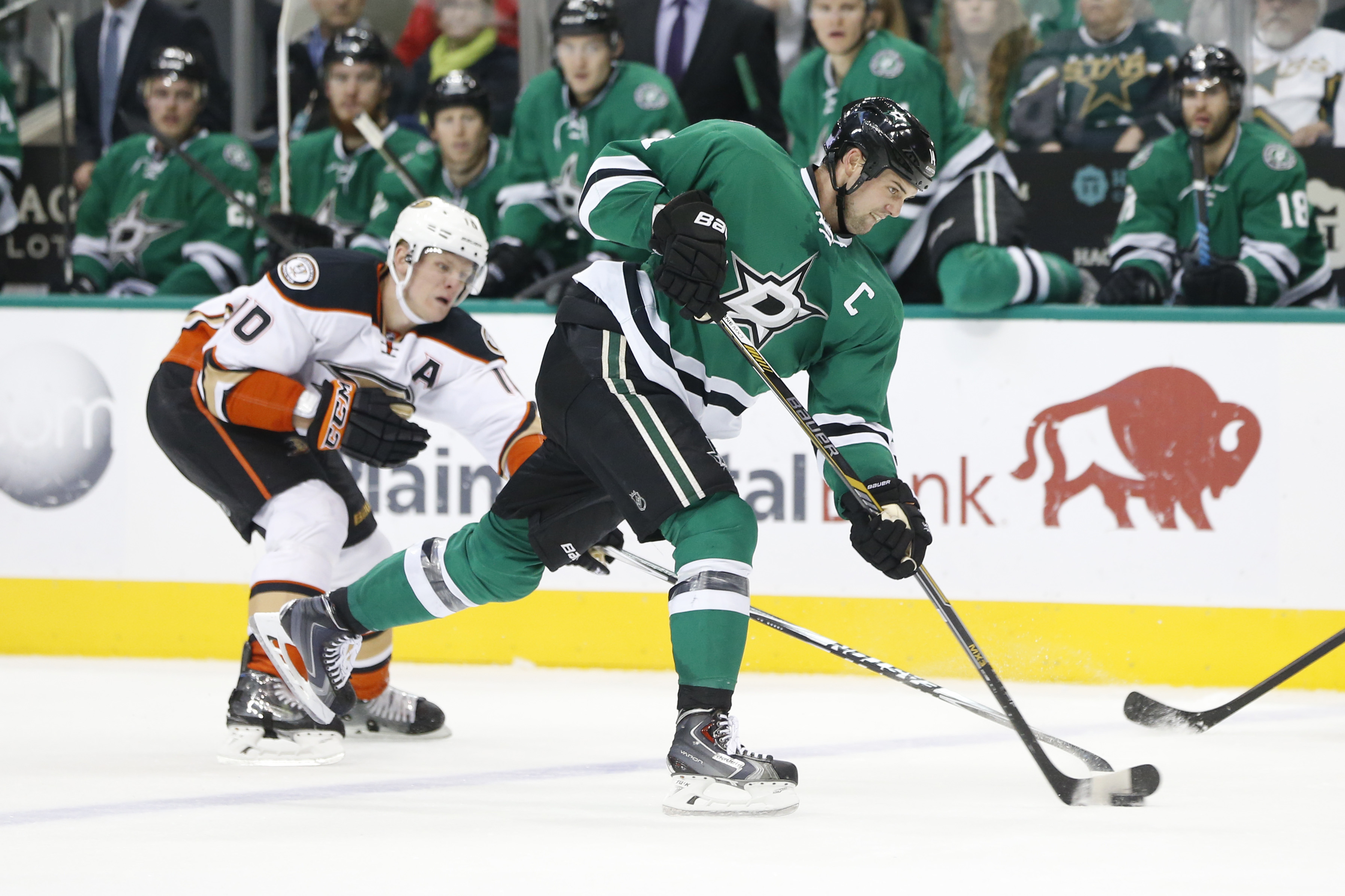 Jamie Benn takes a shot with Corey Perry backchecking last season at American Airlines Arena.