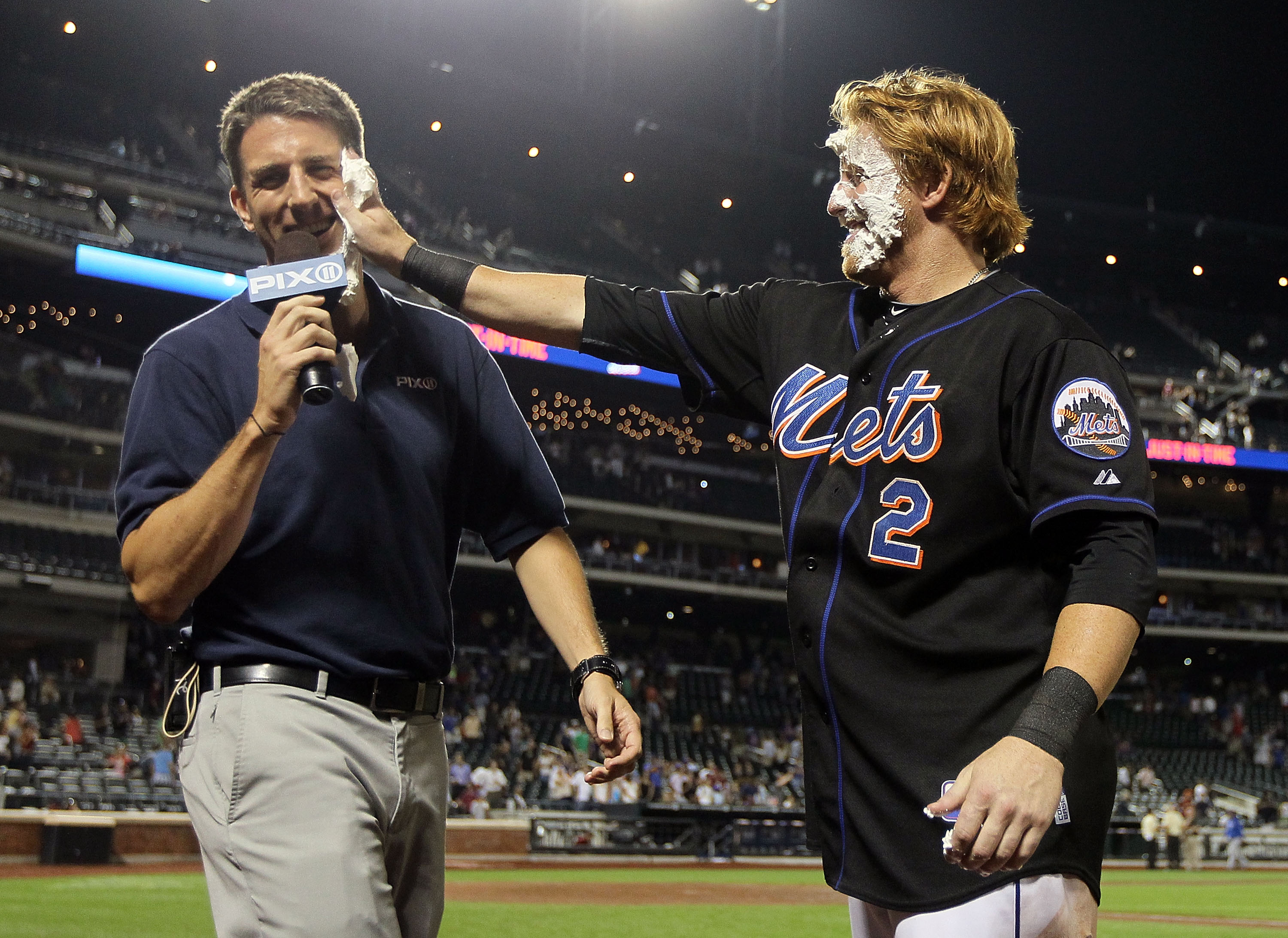 Kevin Burkhardt getting a pie in the face from former Met Justin Turner.
