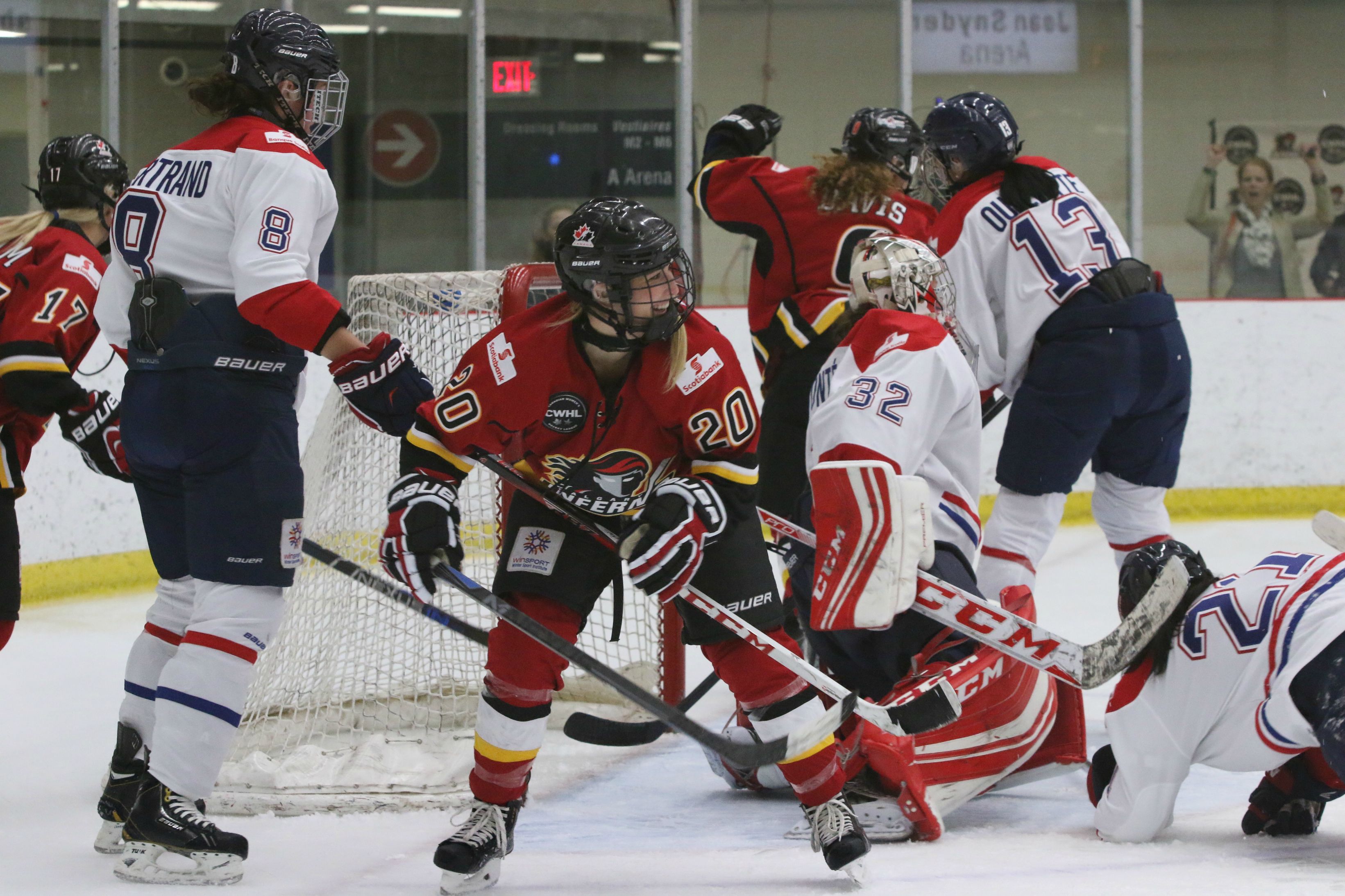 Jessica Campbell, center, reacts to the opening goal by teammate Sarah Davis to put the Inferno up 2-0. Campbell had a lot to smile about, as she led the night with two goals and an assist for Calgary.