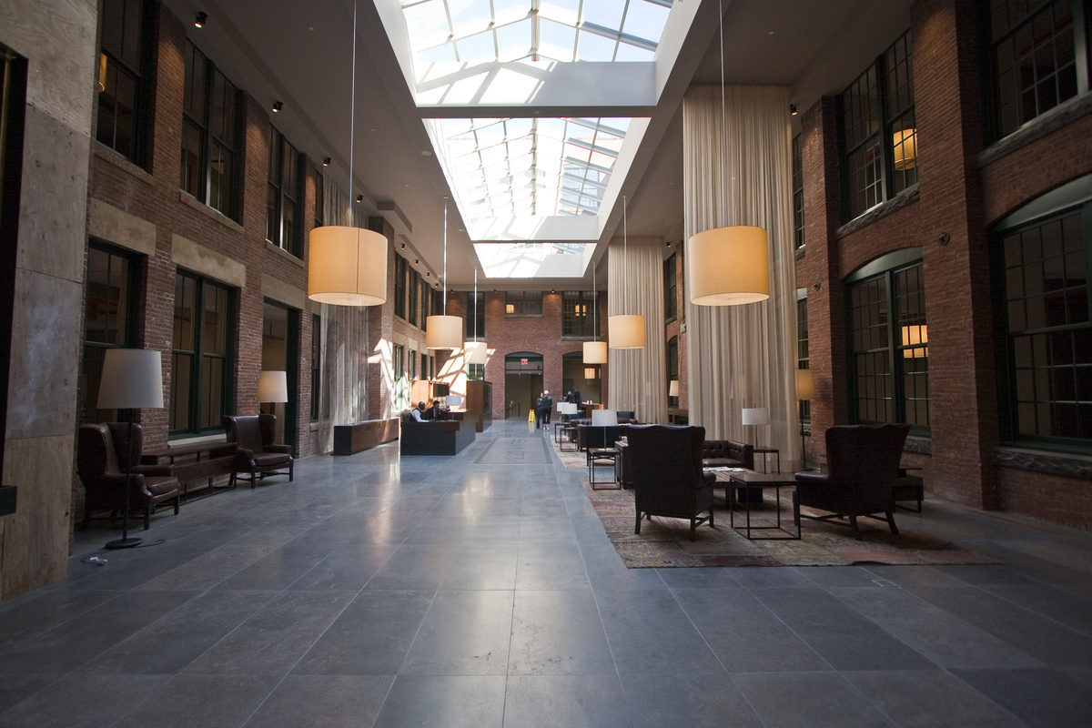 The long view of the building's lobby looking toward the Water Street side. The waterfall is on the left in the foreground.