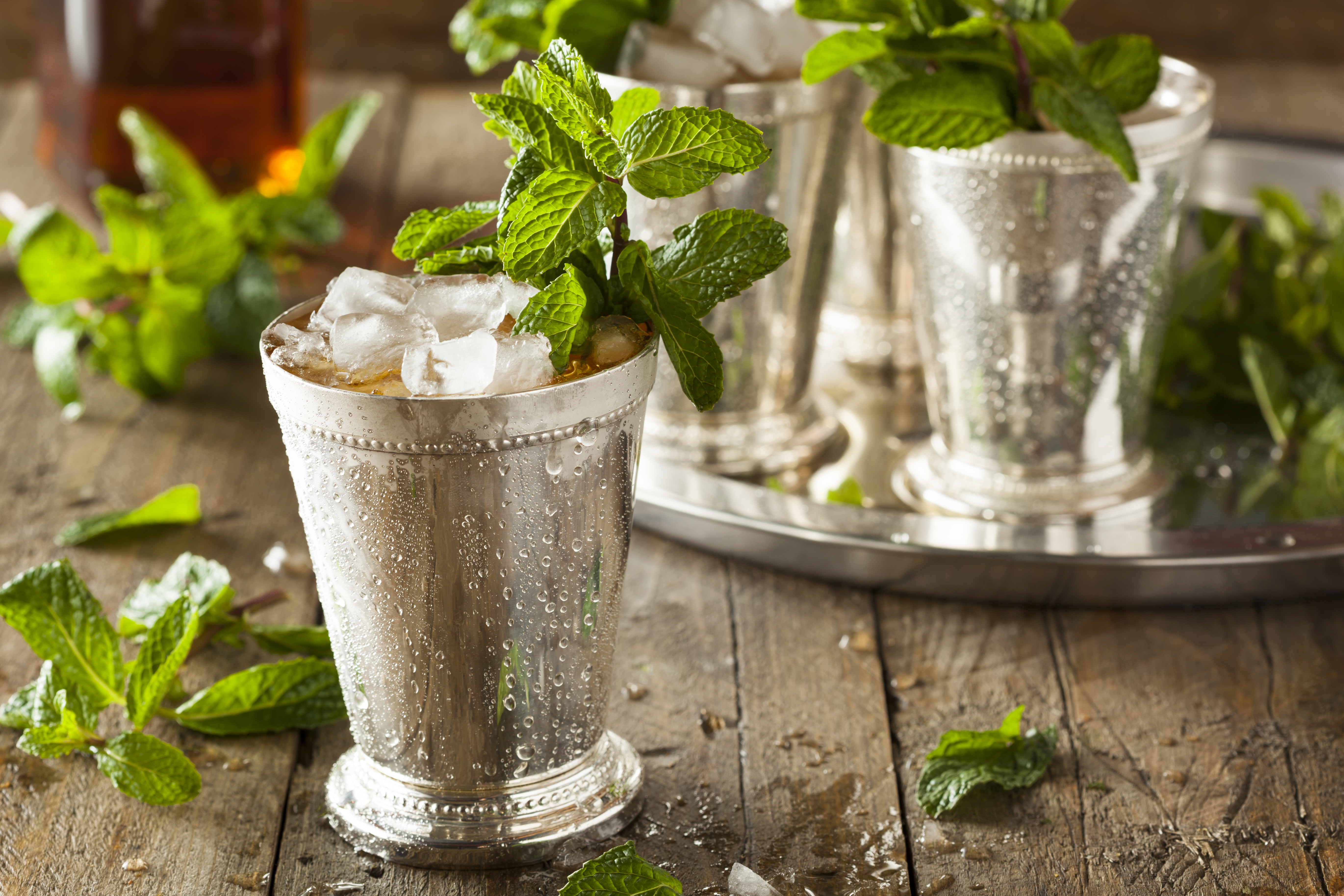Silver julep glasses with mint.