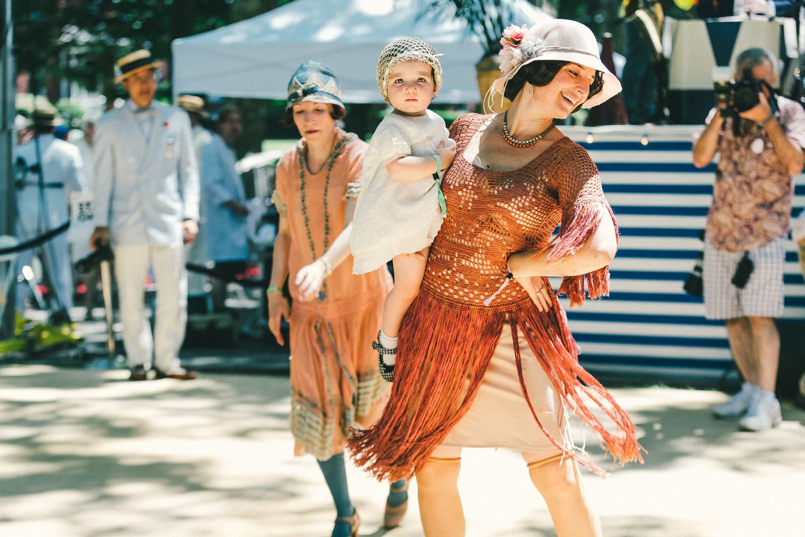 A mom and baby at the <a href="http://ny.racked.com/2015/6/16/8786627/jazz-age-lawn-party-2015-photos#4769478">Jazz Age Lawn Party</a> in 2015