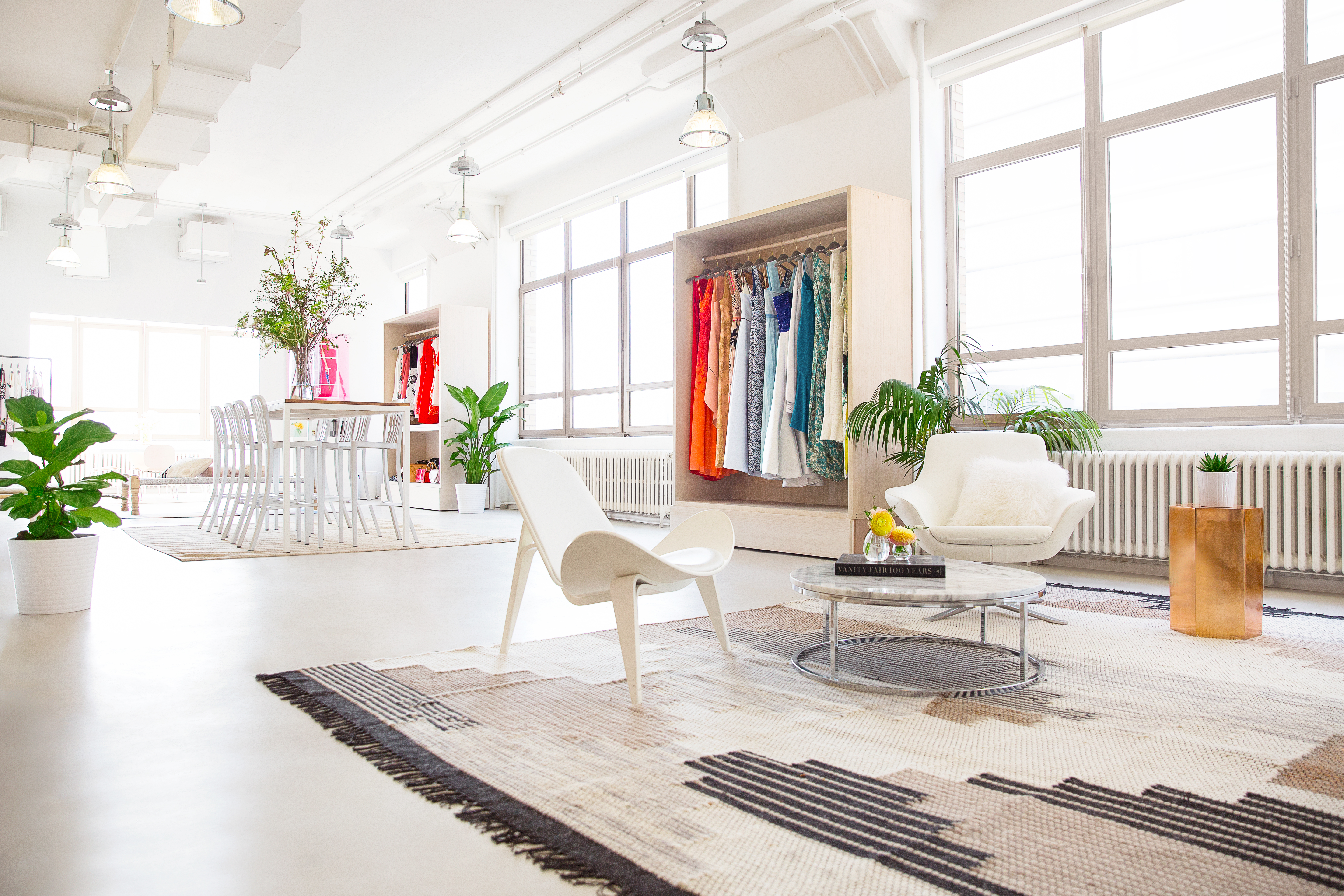 The bright, mostly white Rent the Runway style studio