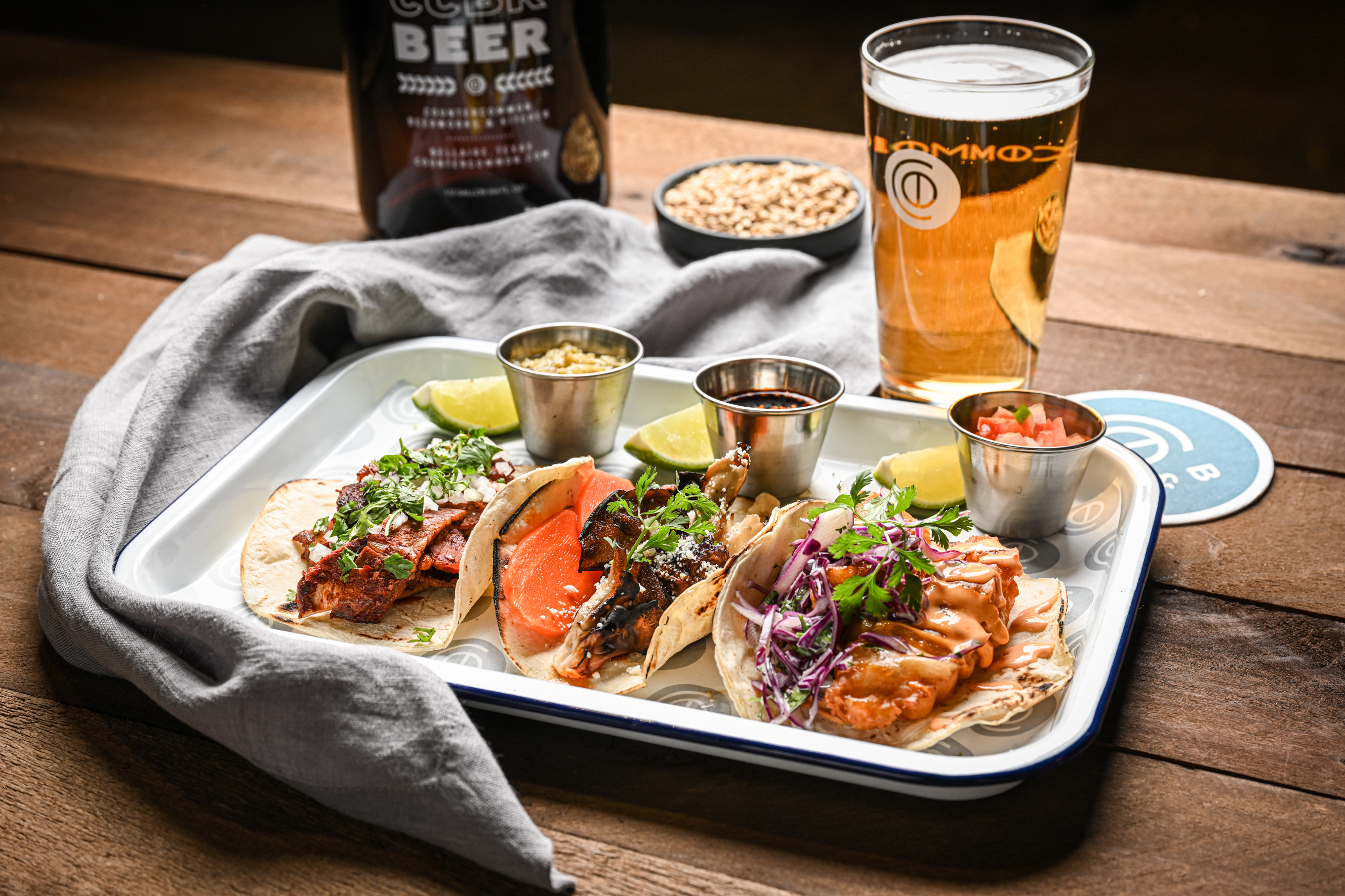 A selection of tacos and a glass of beer at CounterCommon Beerworks &amp; Kitchen.