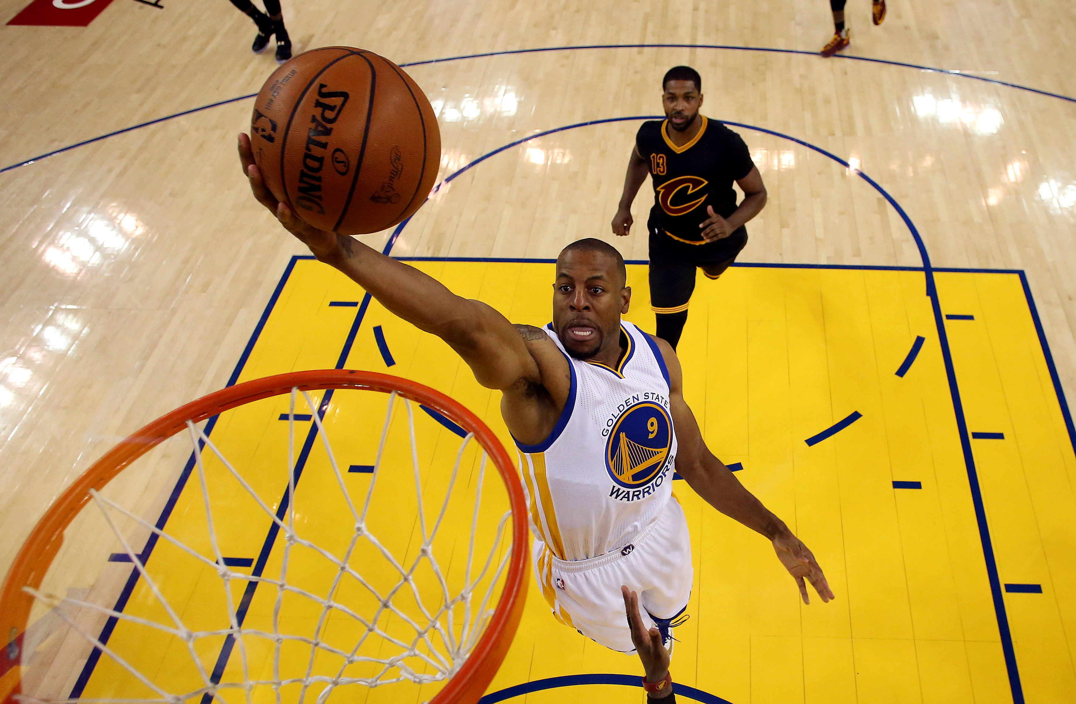 Andre Iguodala soars to the rim ahead of the pack.