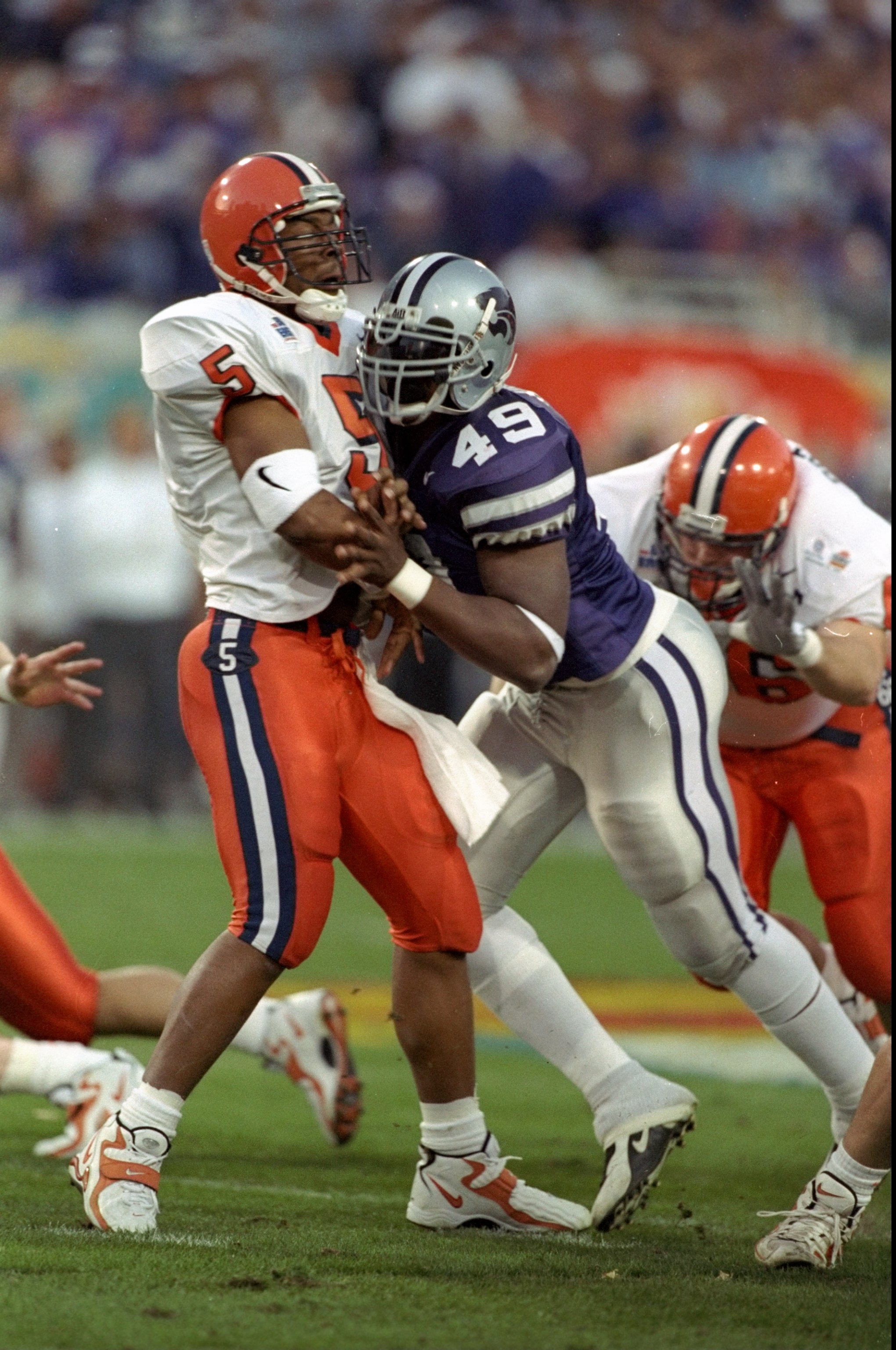 I couldn't find any pictures of a K-State running back wearing No. 49, so here's a delightful throwback picture of Darren Howard sacking Donovan McNabb instead. Made your day, didn't it?