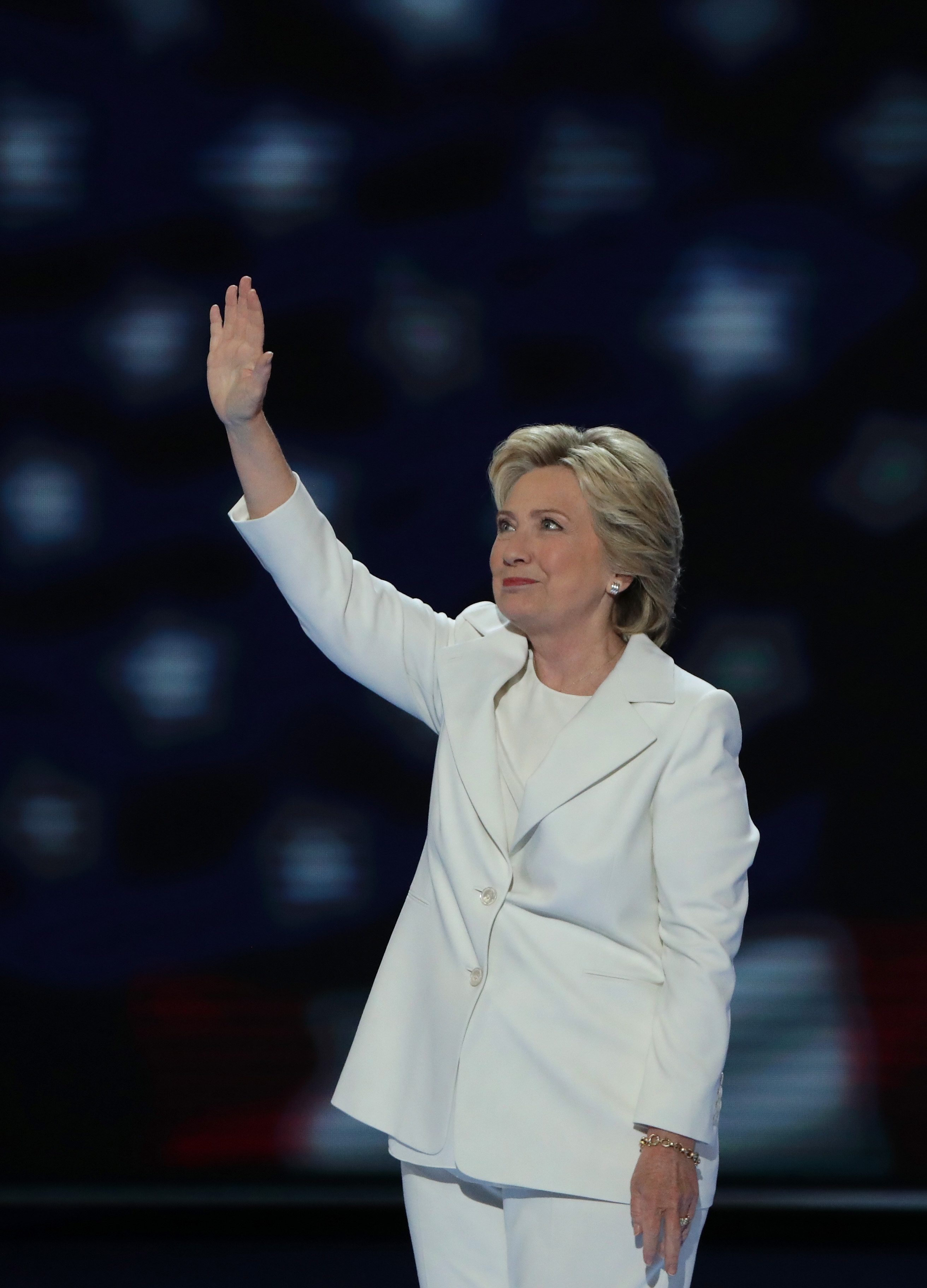 PHILADELPHIA, PA - JULY 28:  Democratic presidential candidate Hillary Clinton acknowledges the crowd as she arrives on stage during the fourth day of the Democratic National Convention at the Wells Fargo Center, July 28, 2016 in Philadelphia, Pennsylvania. Democratic presidential candidate Hillary Clinton received the number of votes needed to secure the party's nomination. An estimated 50,000 people are expected in Philadelphia, including hundreds of protesters and members of the media. The four-day Democratic National Convention kicked off July 25.  (Photo by Alex Wong/Getty Images)
