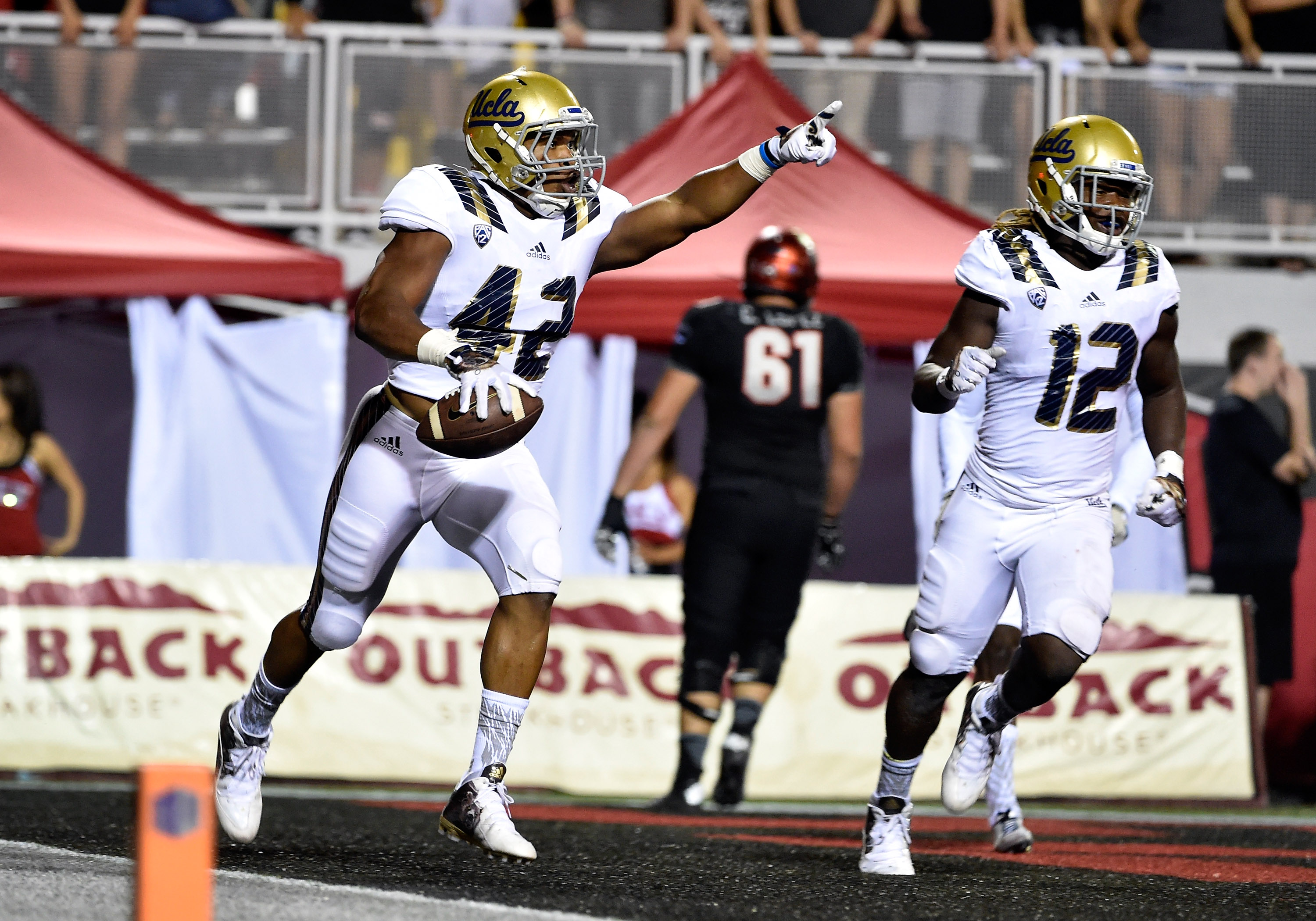 UCLA linebacker Kenny Young celebrates after his pick six against UNLV last season