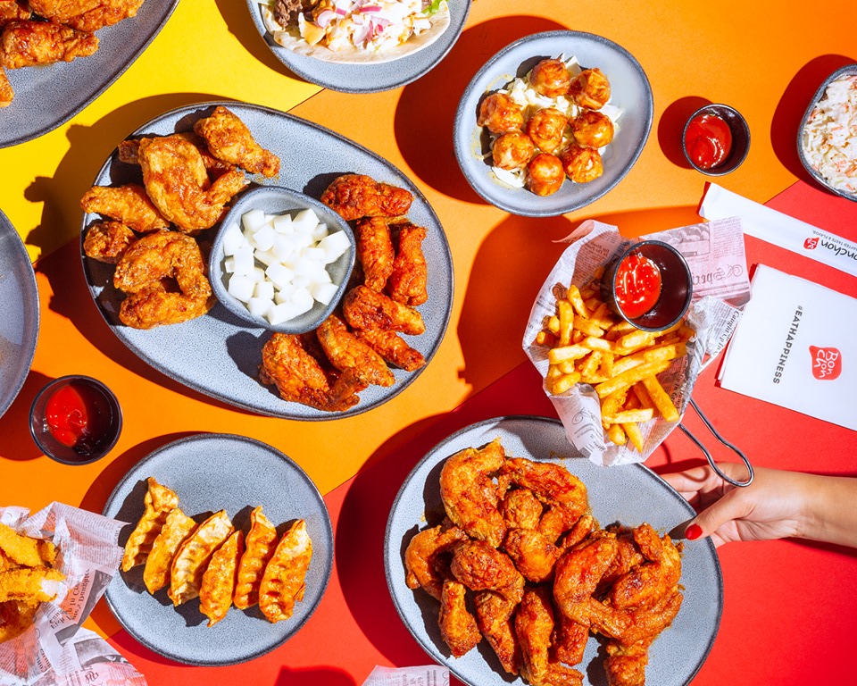 A top-down image of chicken wings and fixings.